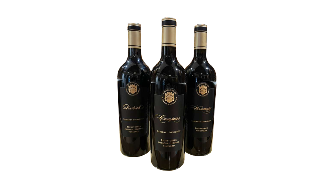 Three bottles of red wines, Cabernet Sauvignon wine from Beckstoffer Missouri Hopes Vineyard, with black labels and gold accents, standing on a black background.