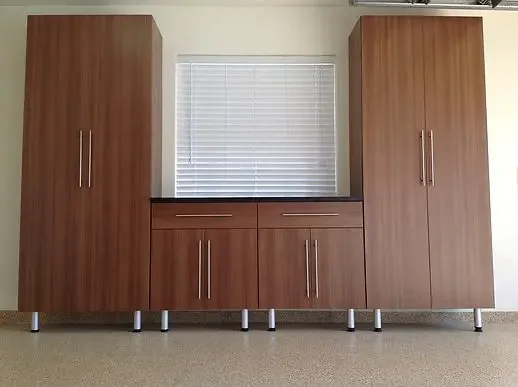 Brown floor to ceiling cabinets with doors for storageage