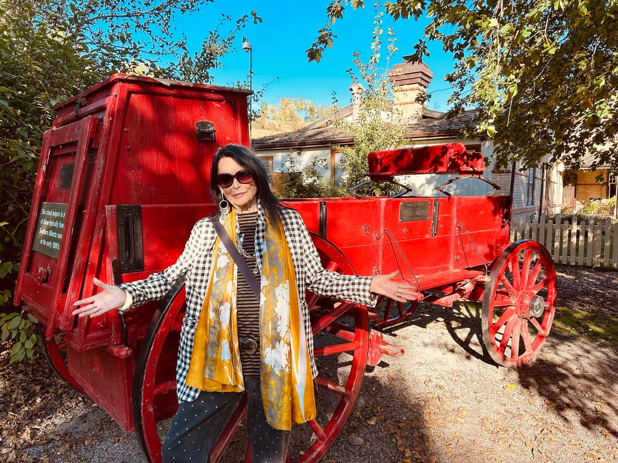 Anne Waldman in front of the chuckwagon following the film screening of Outrider at the Wise Women Festival in Calgary, Canada, September 20, 2026, photo by HR Hegnauer.