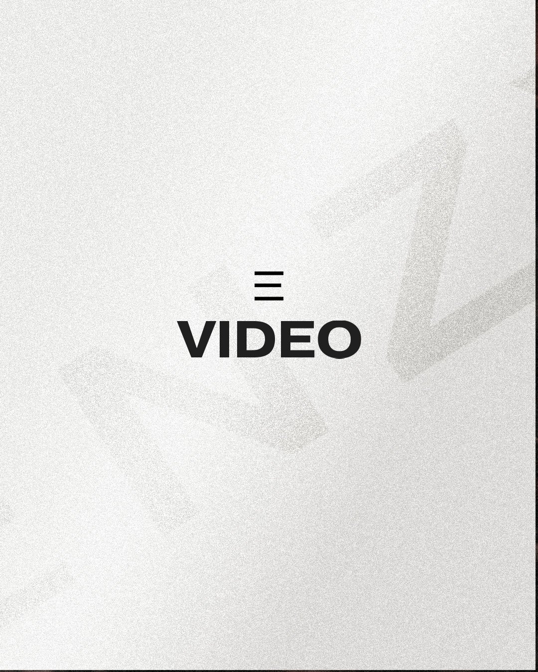 Text reading "VIDEO" on a textured gray background with faint symbols.