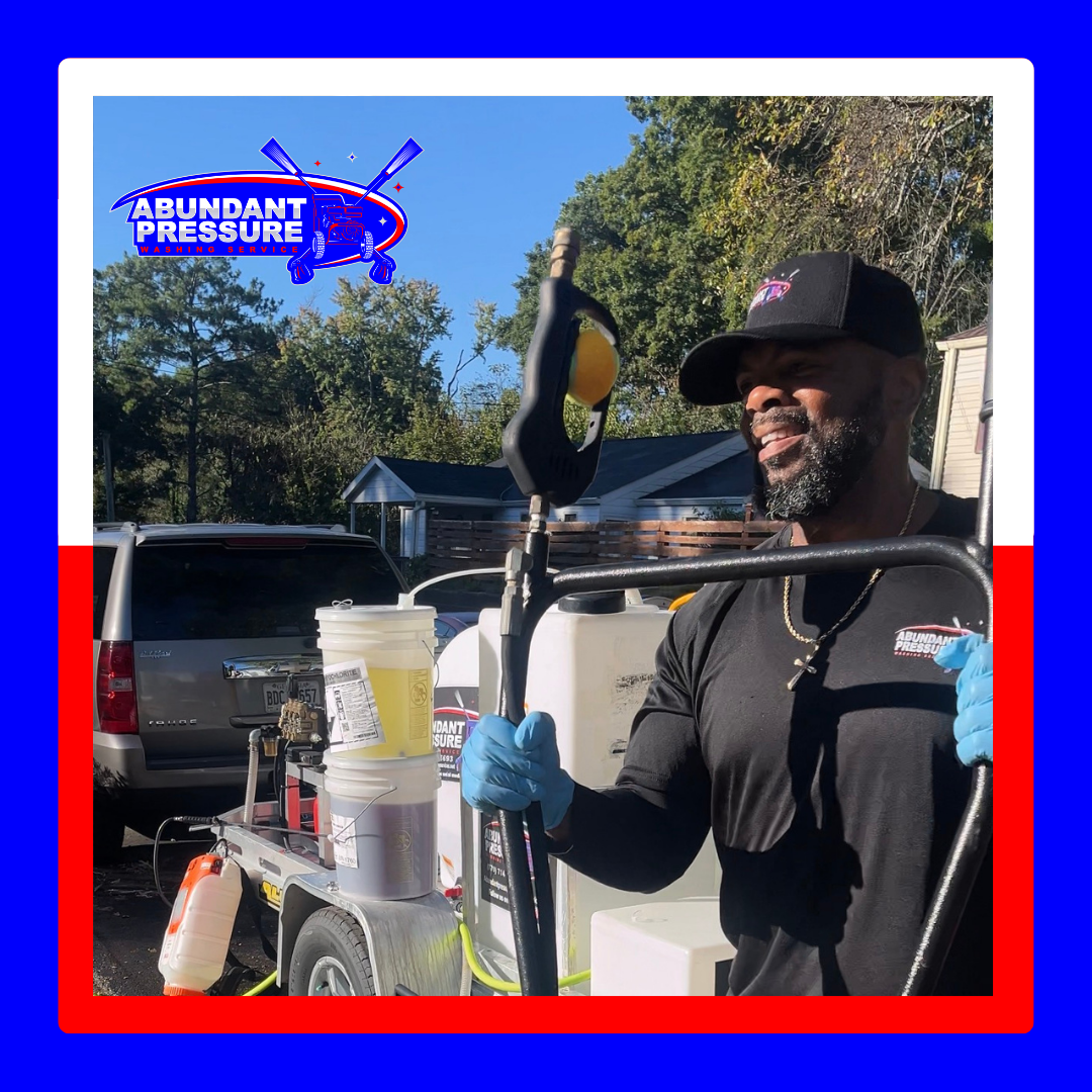A picture of Corey (Owner of Abundant Pressure Washing) getting ready to pressure wash a driveway in Hampton, GA