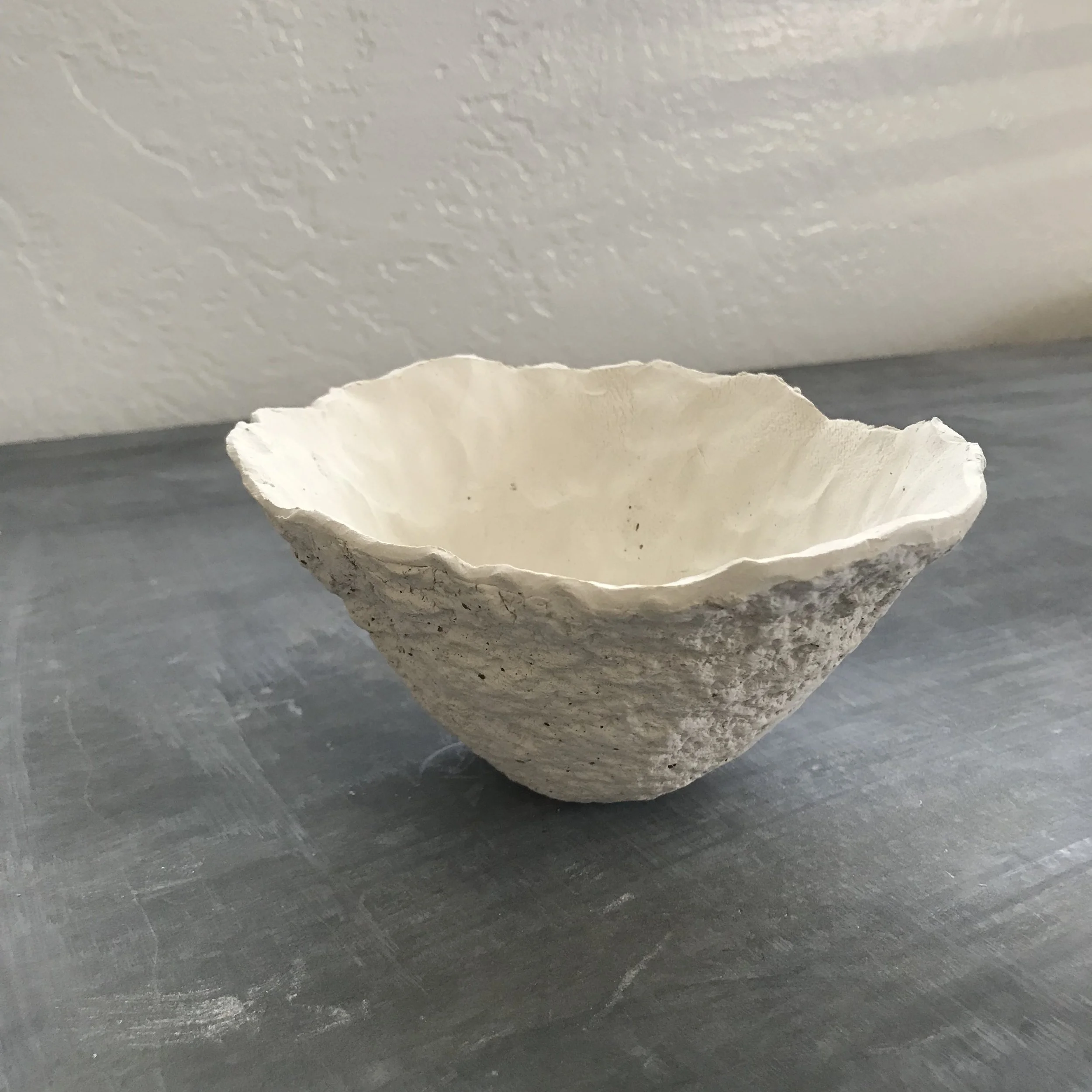 "Of the land" hand-built bowl, press molded into a mortar stone found on Ceramic Artist Lisa Love's Studio Property in the historic town of Oracle, Arizona.