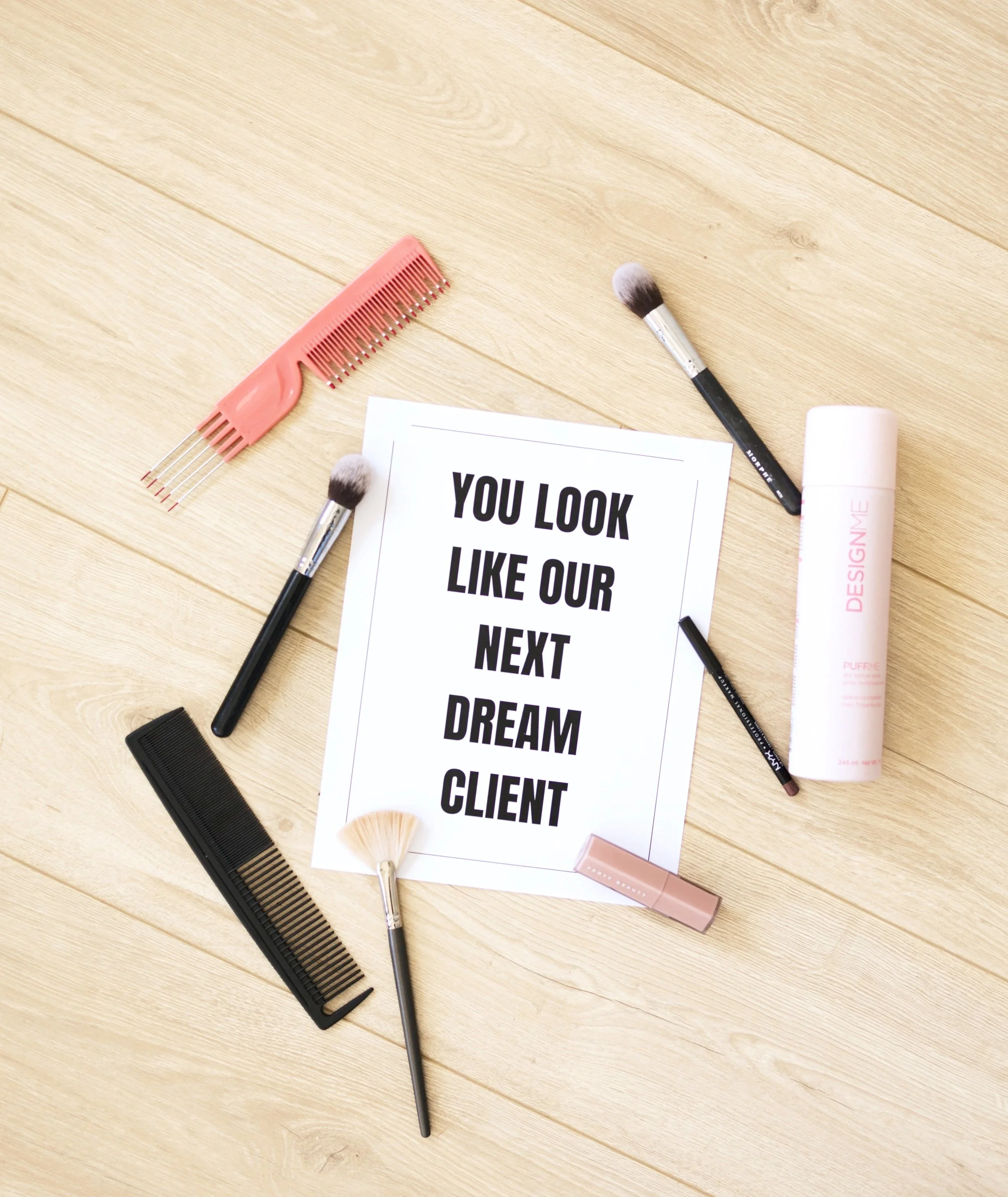 business advertisement on the floor with hairstyling and makeup tools