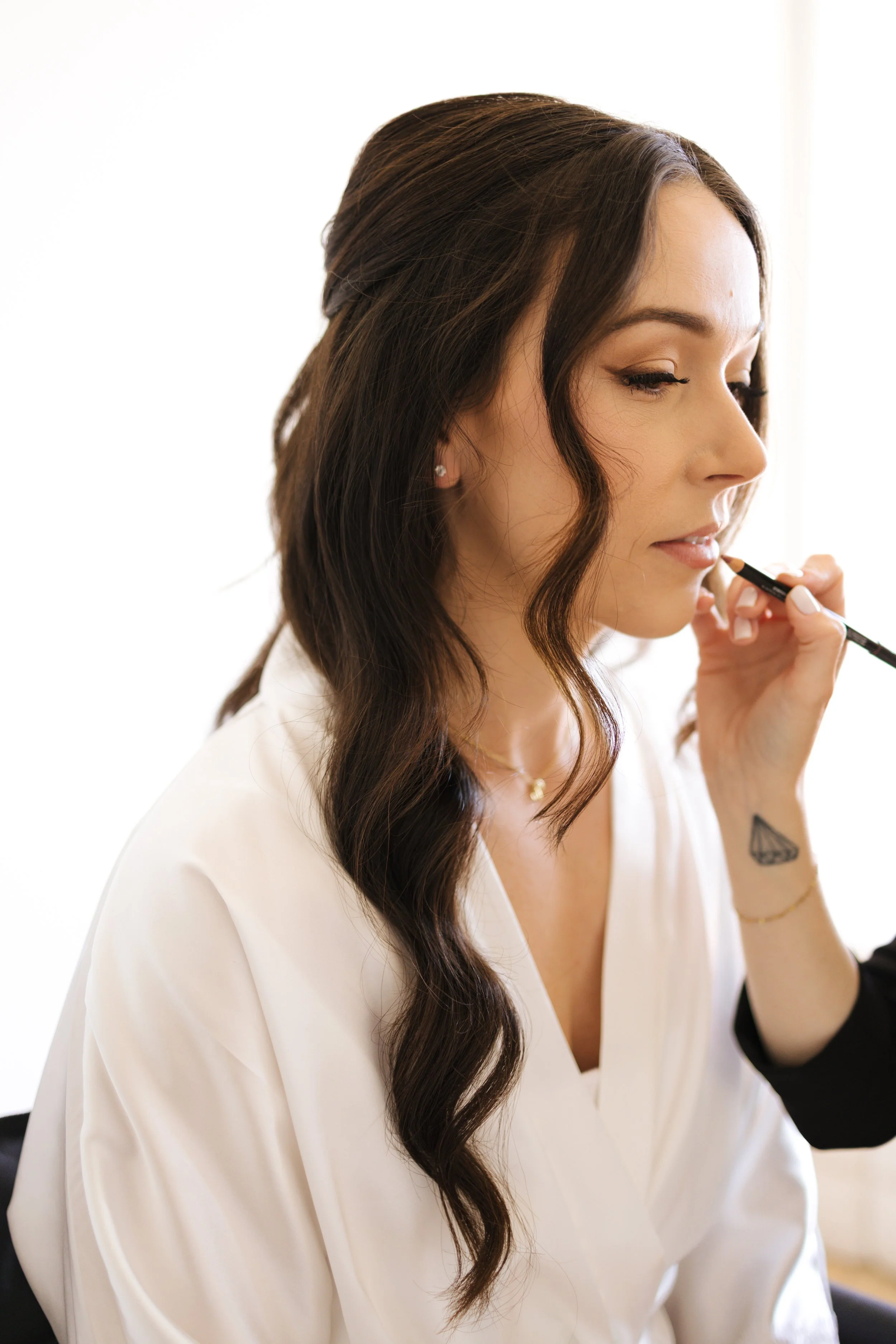 bride getting her makeup done