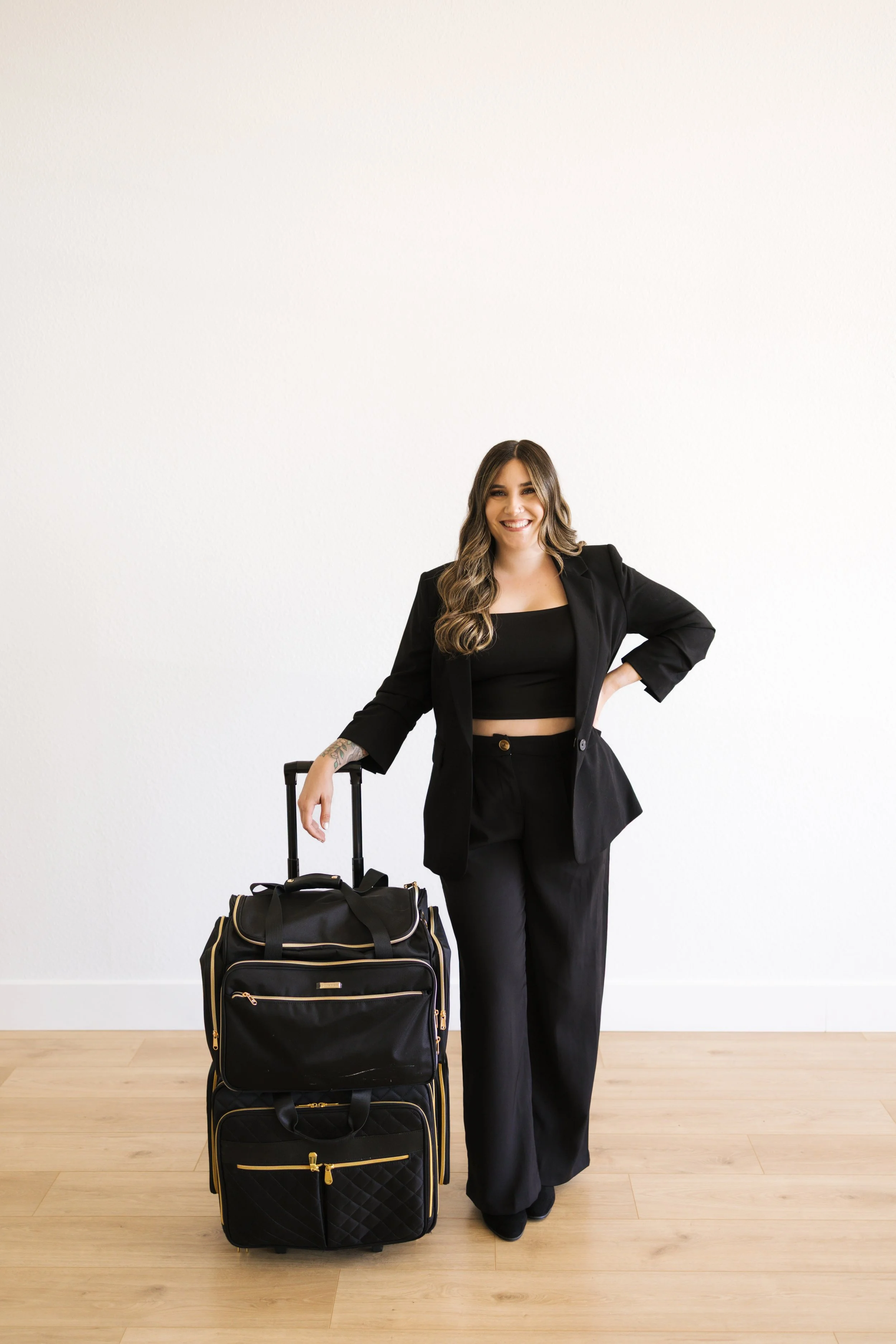 hairstylist with her rolling bag of supplies