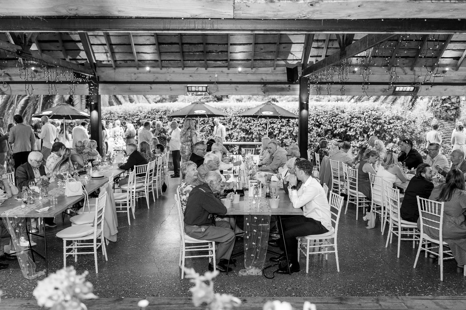 Black and white photo of the reception in the open barn