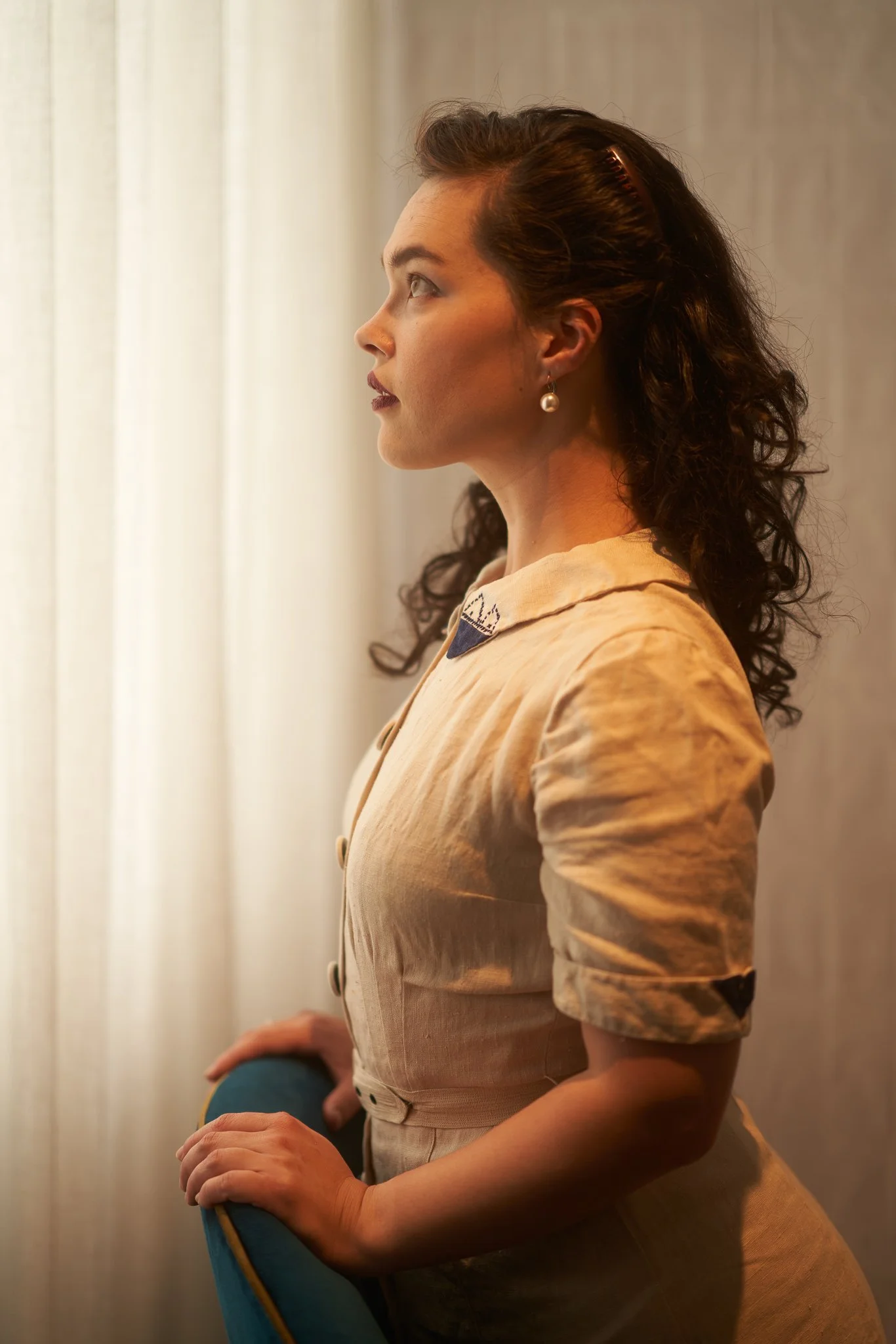 Anita in profile wearing a vintage blouse