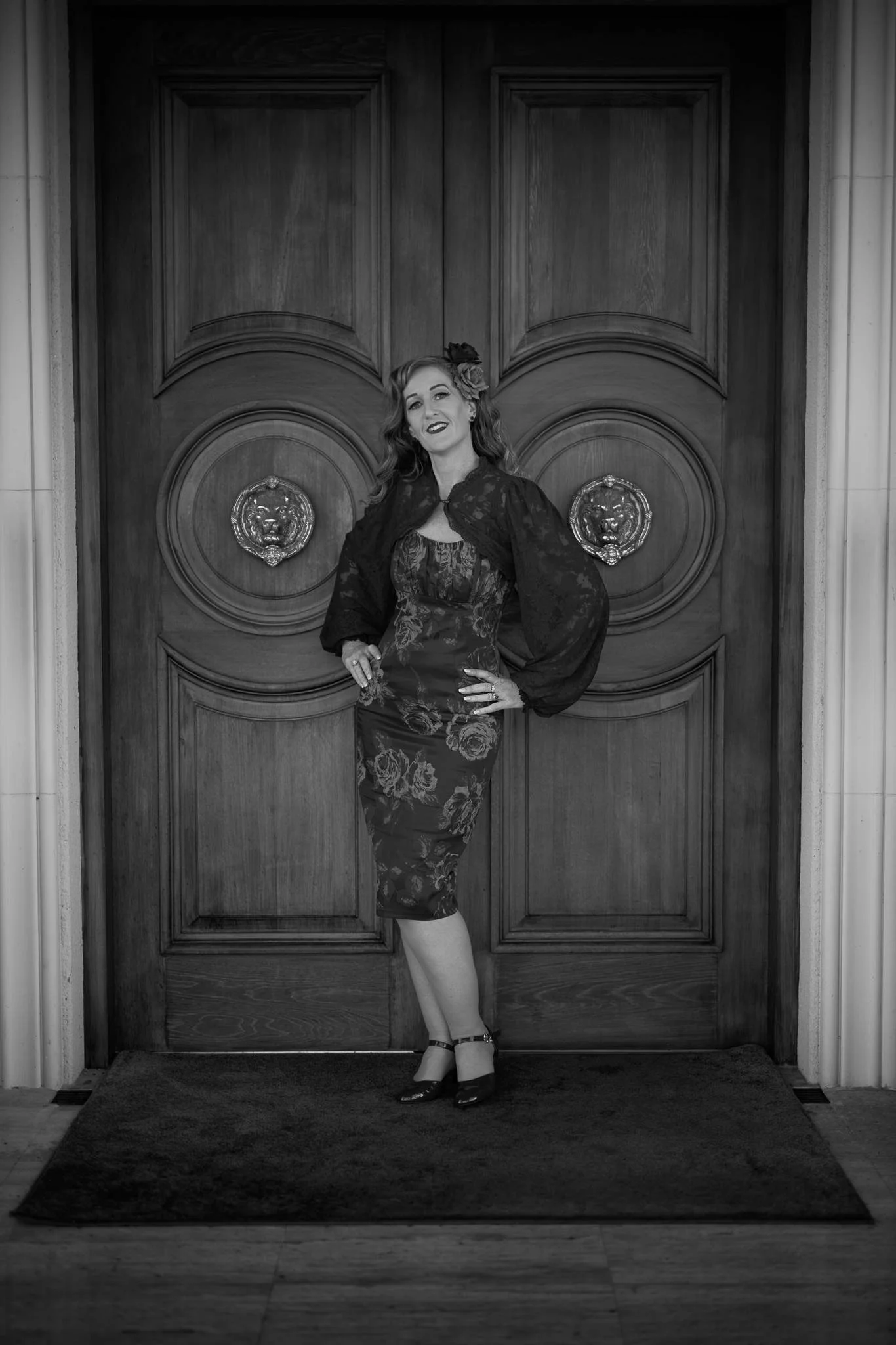 Black and white photo of Sandy before the wooden doors