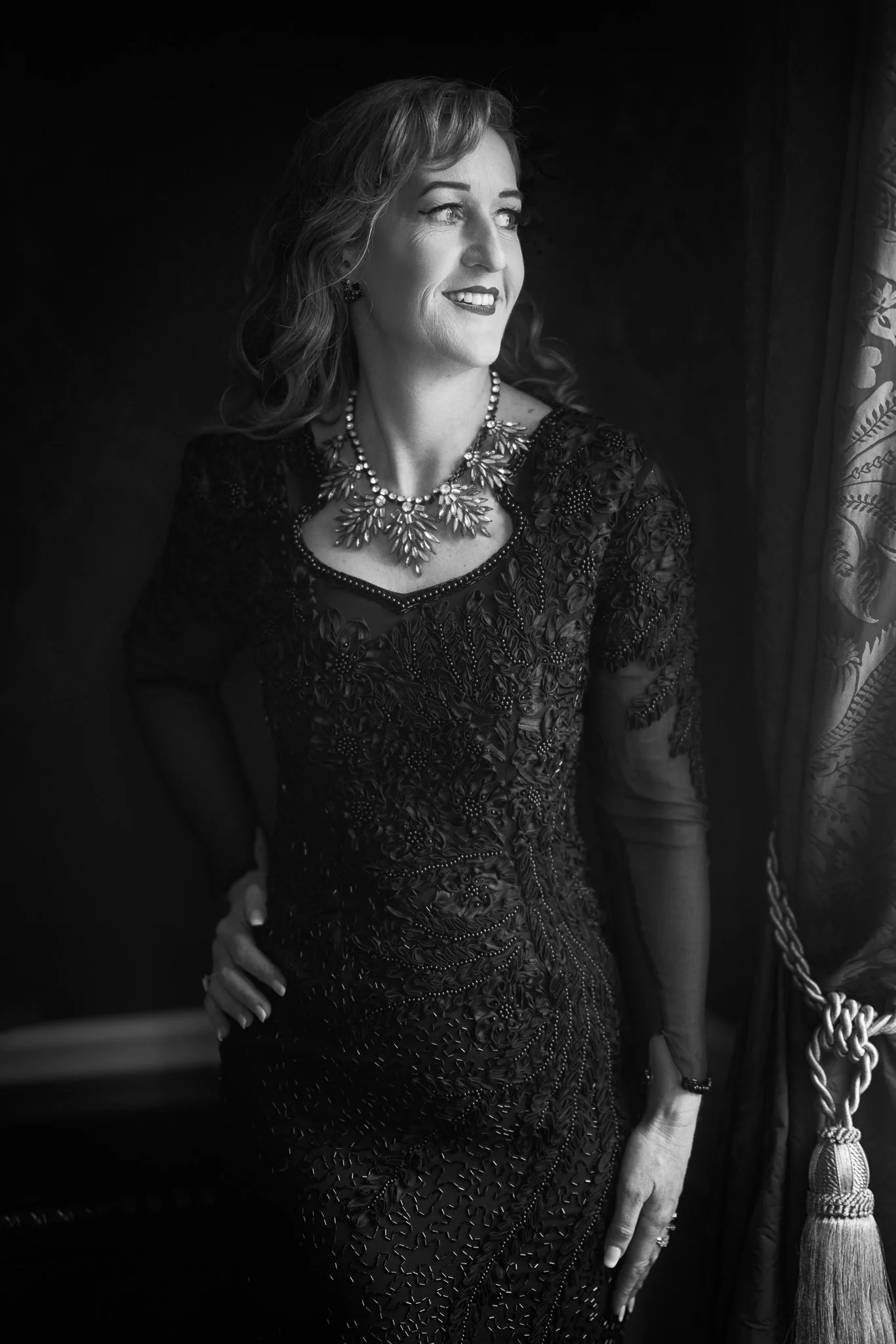 Black and white photo of Sandy in a beaded black dress