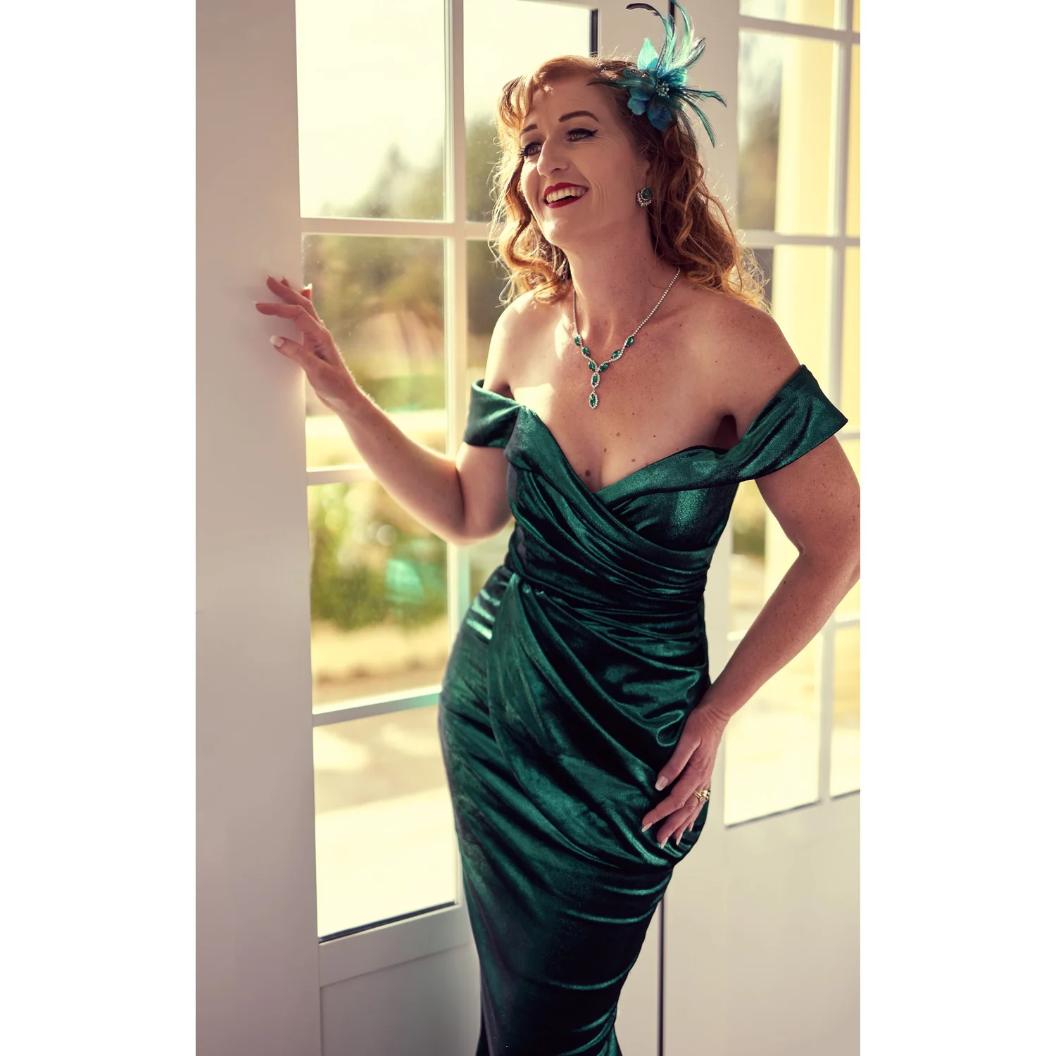 Sandy laughs in bright window light