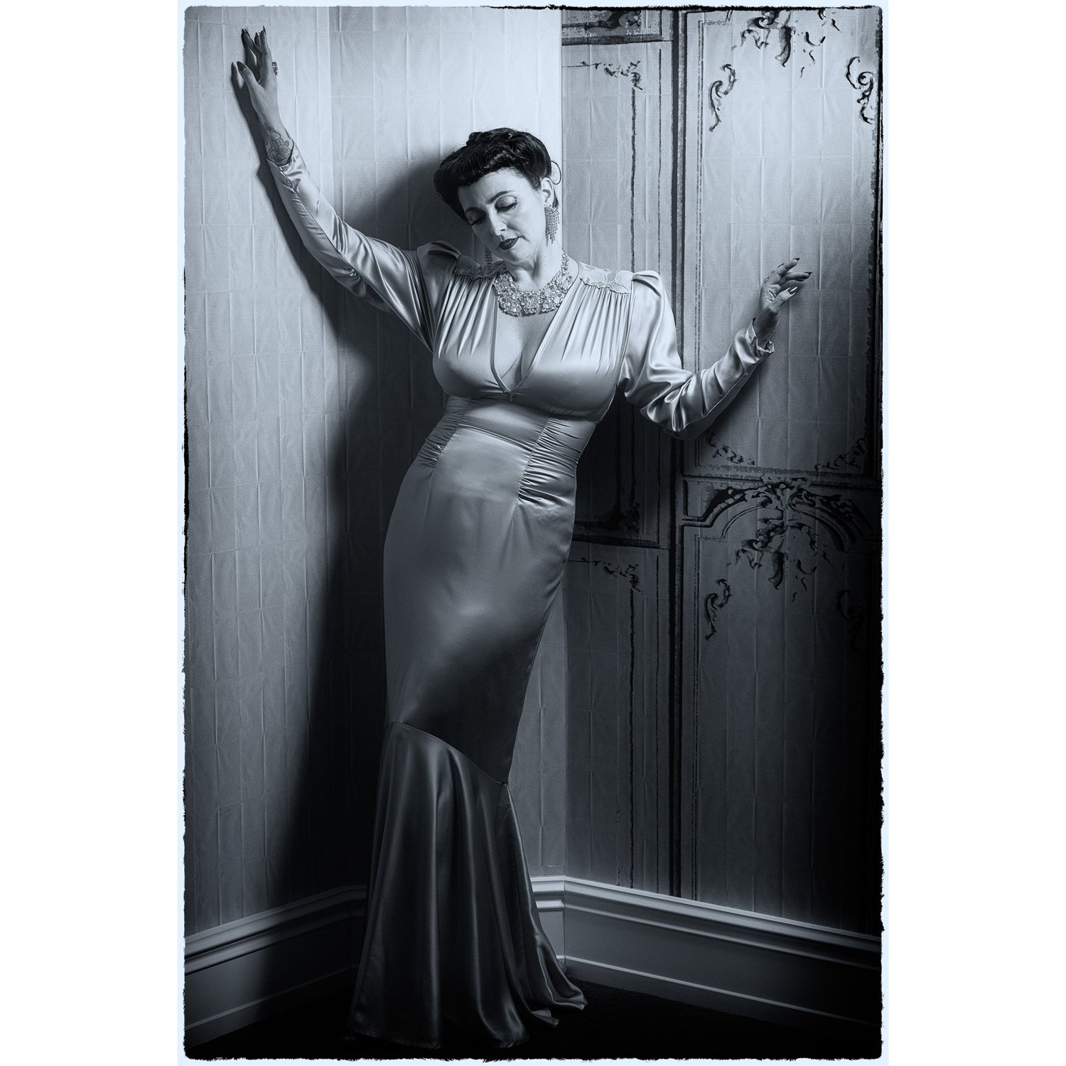 Black and white photo of Viv in a long satin gown
