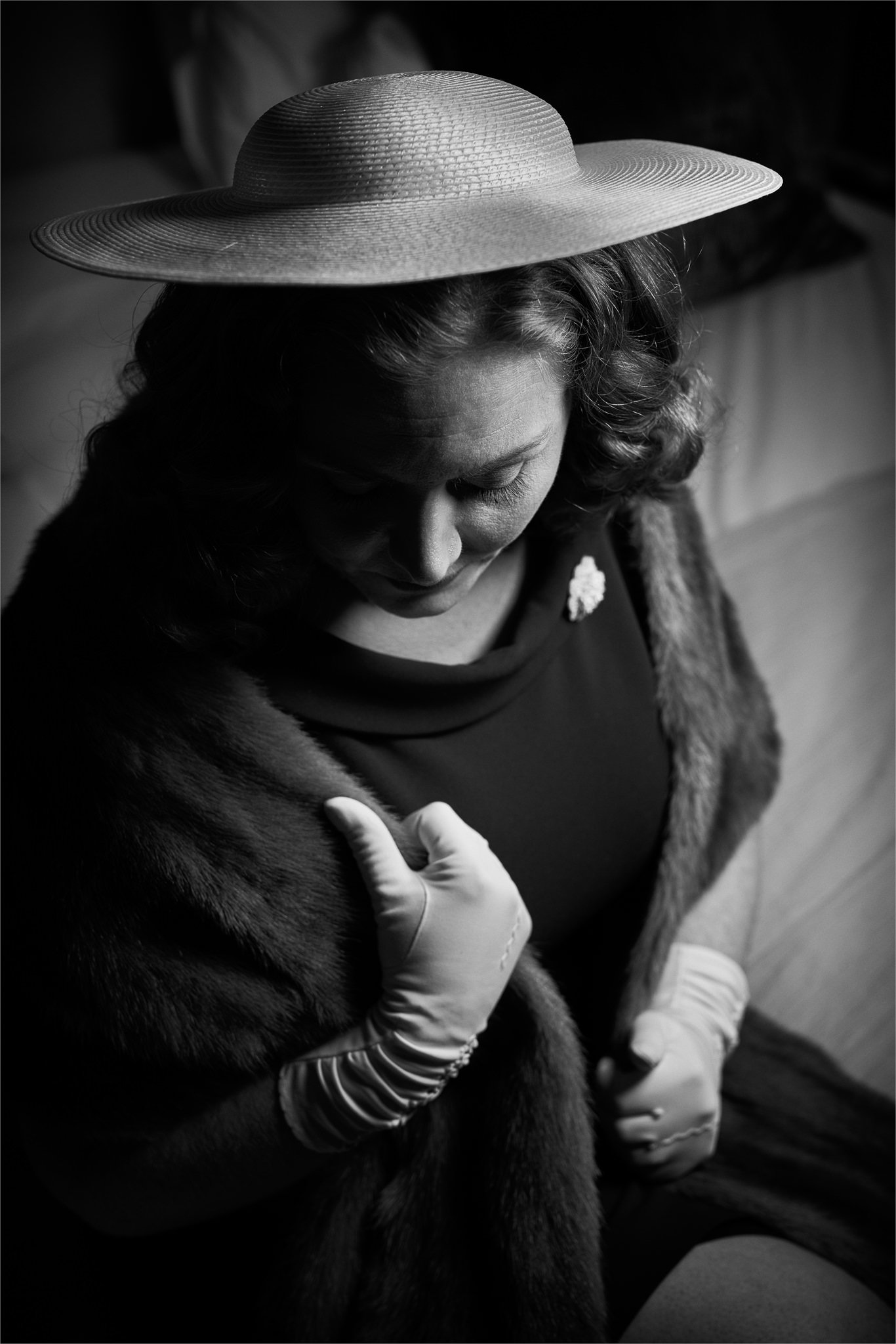 Black and white photo of Laura in a hat and fur stole