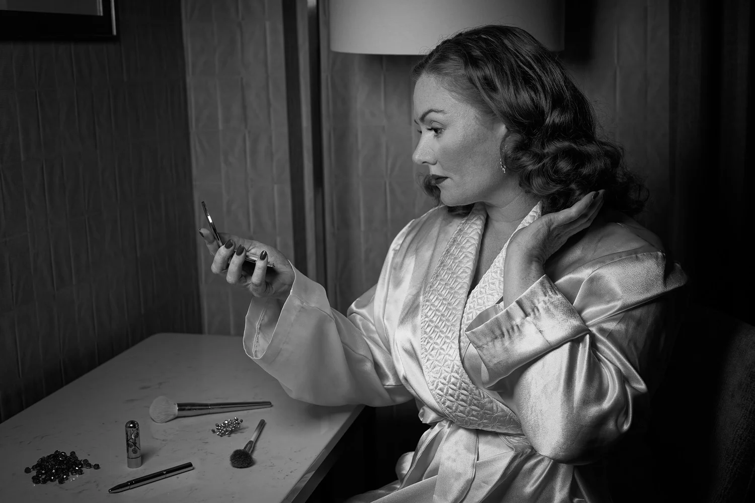 Black and white photo of Laura at a dressing table