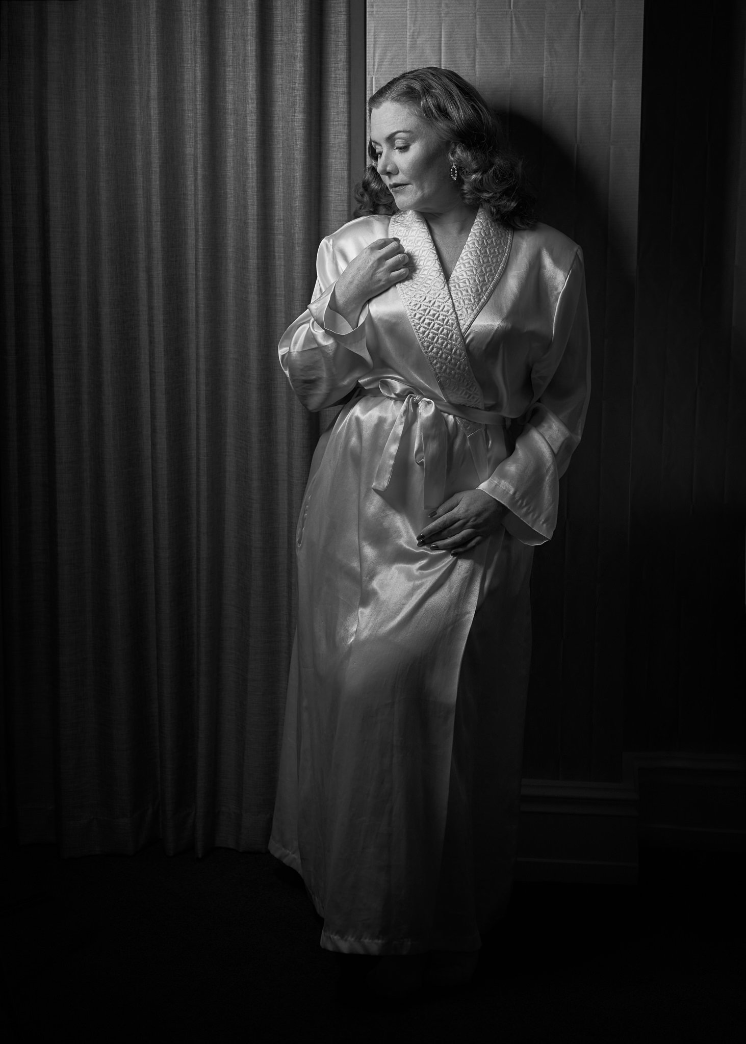 Black and white photo of Laura in a satin robe