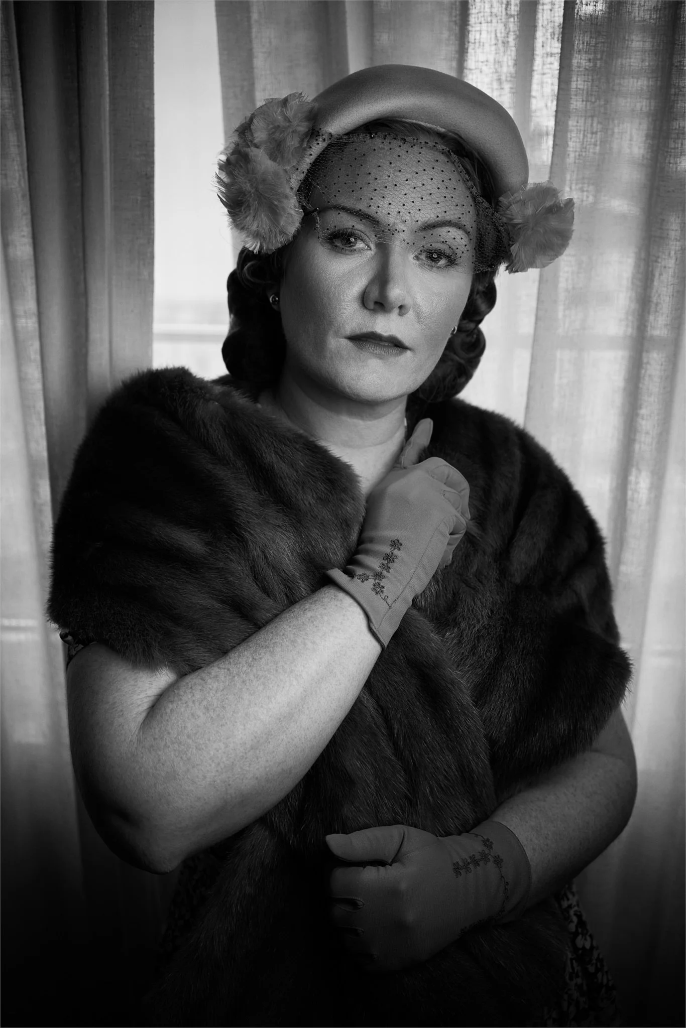 Black and white photo of Laura in a fur wrap