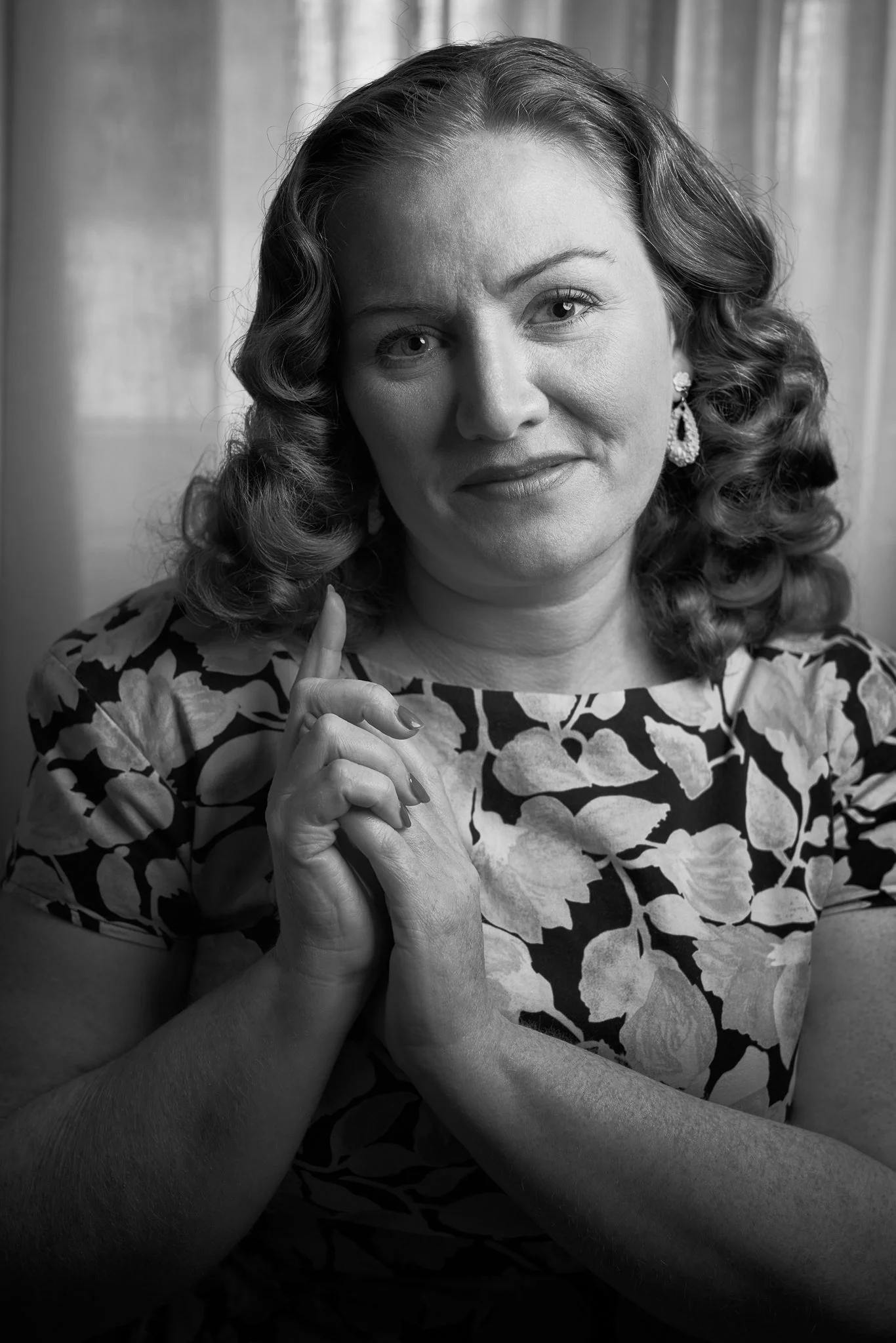 Black and white photo of Laura in a floral dress