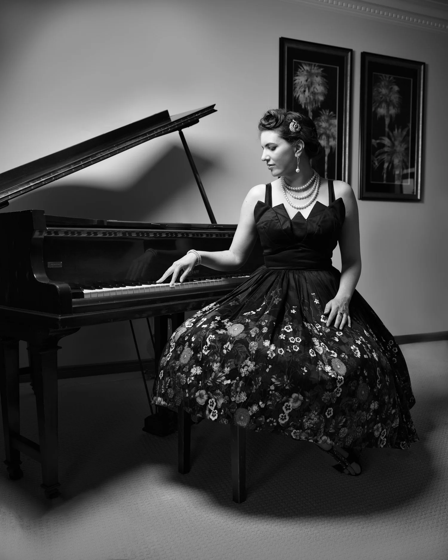 Black and white photo of Jay seated at the piano