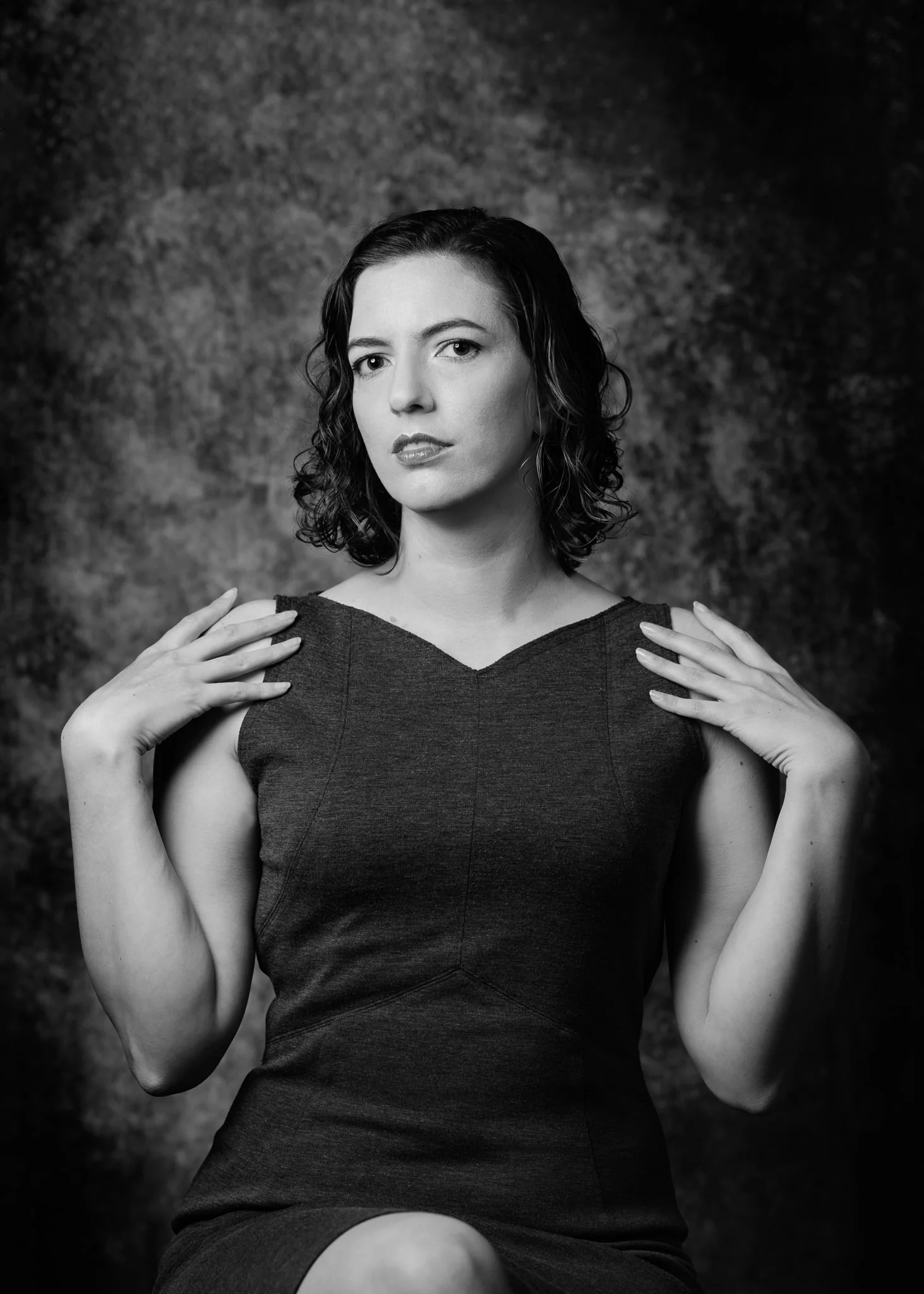 Black and white portrait of Jay in a fitted dress