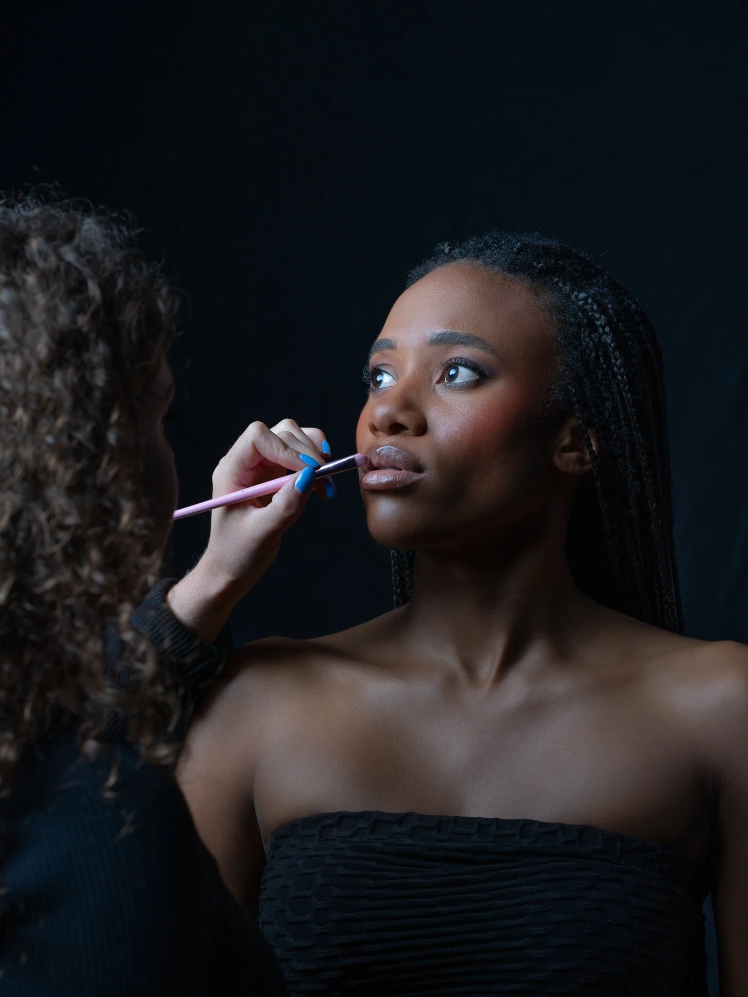 Ty has her makeup applied before the shoot