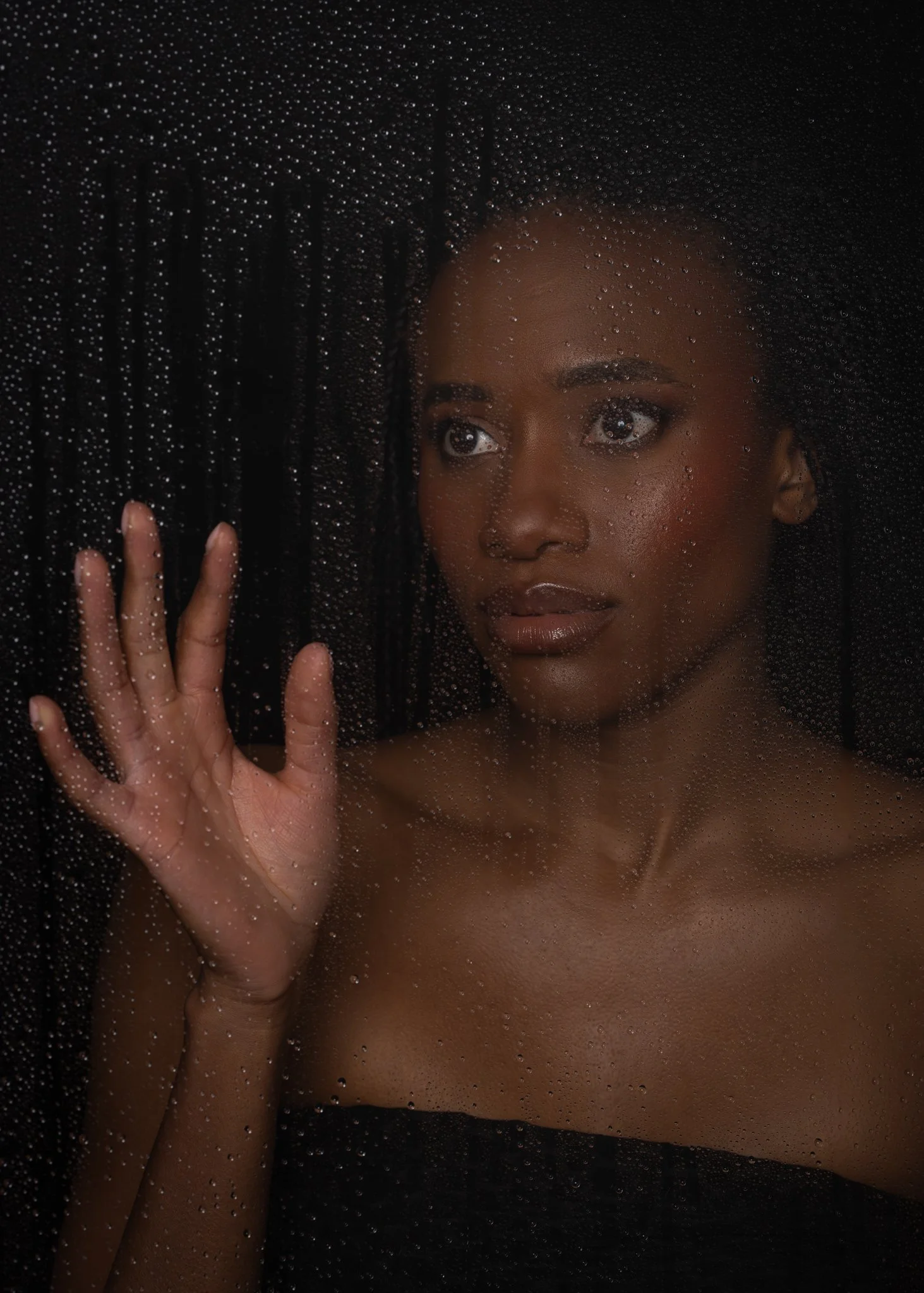 Ty photographed through a rain-speckled glass effect