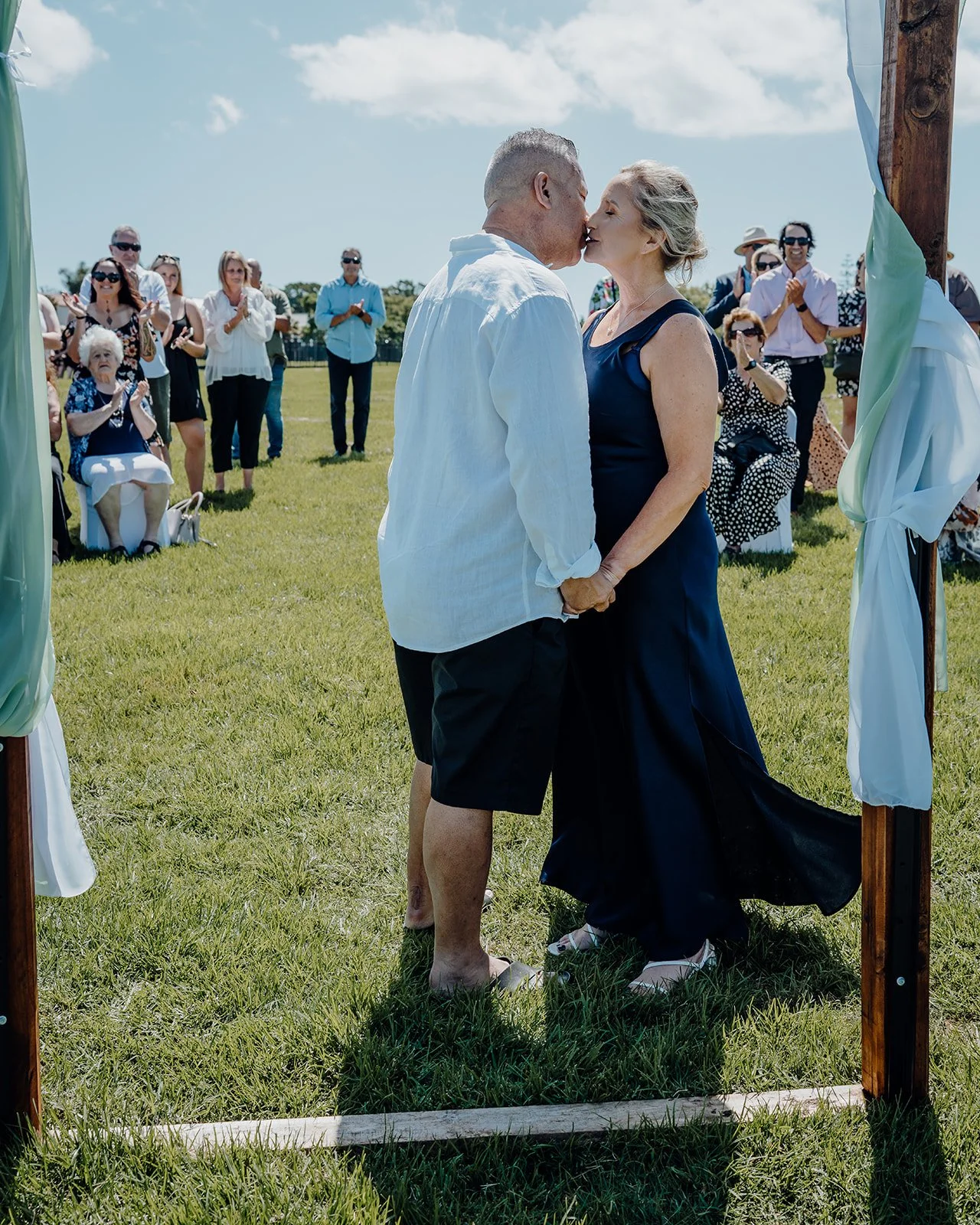 Raewyn and Shane kiss as guests look on