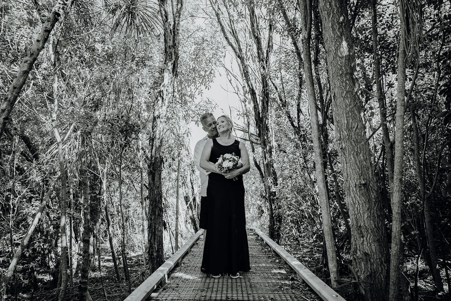 Black and white photo of Raewyn and Shane on the boardwalk
