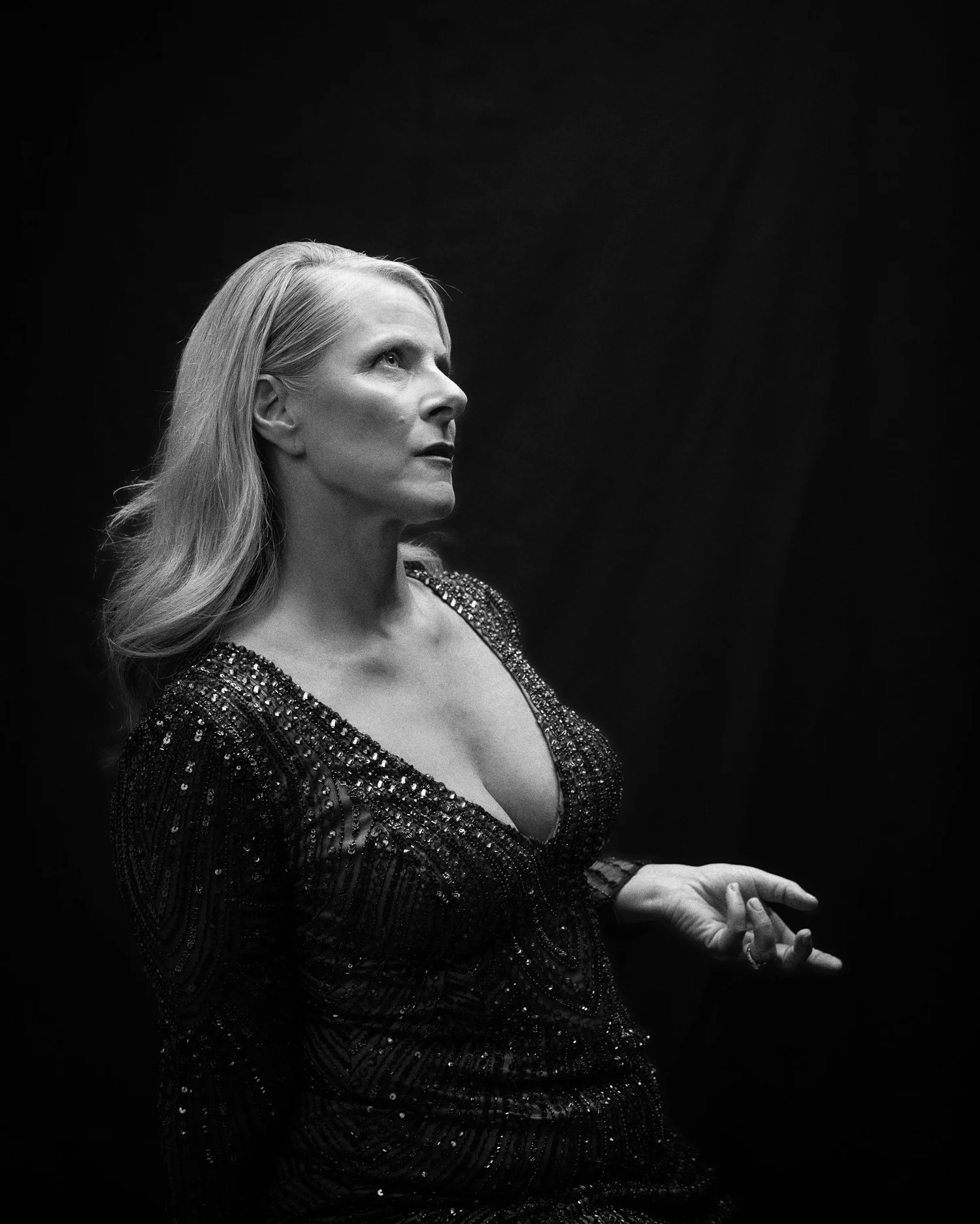 Black and white photo of Ivanka in a sequinned gown in profile