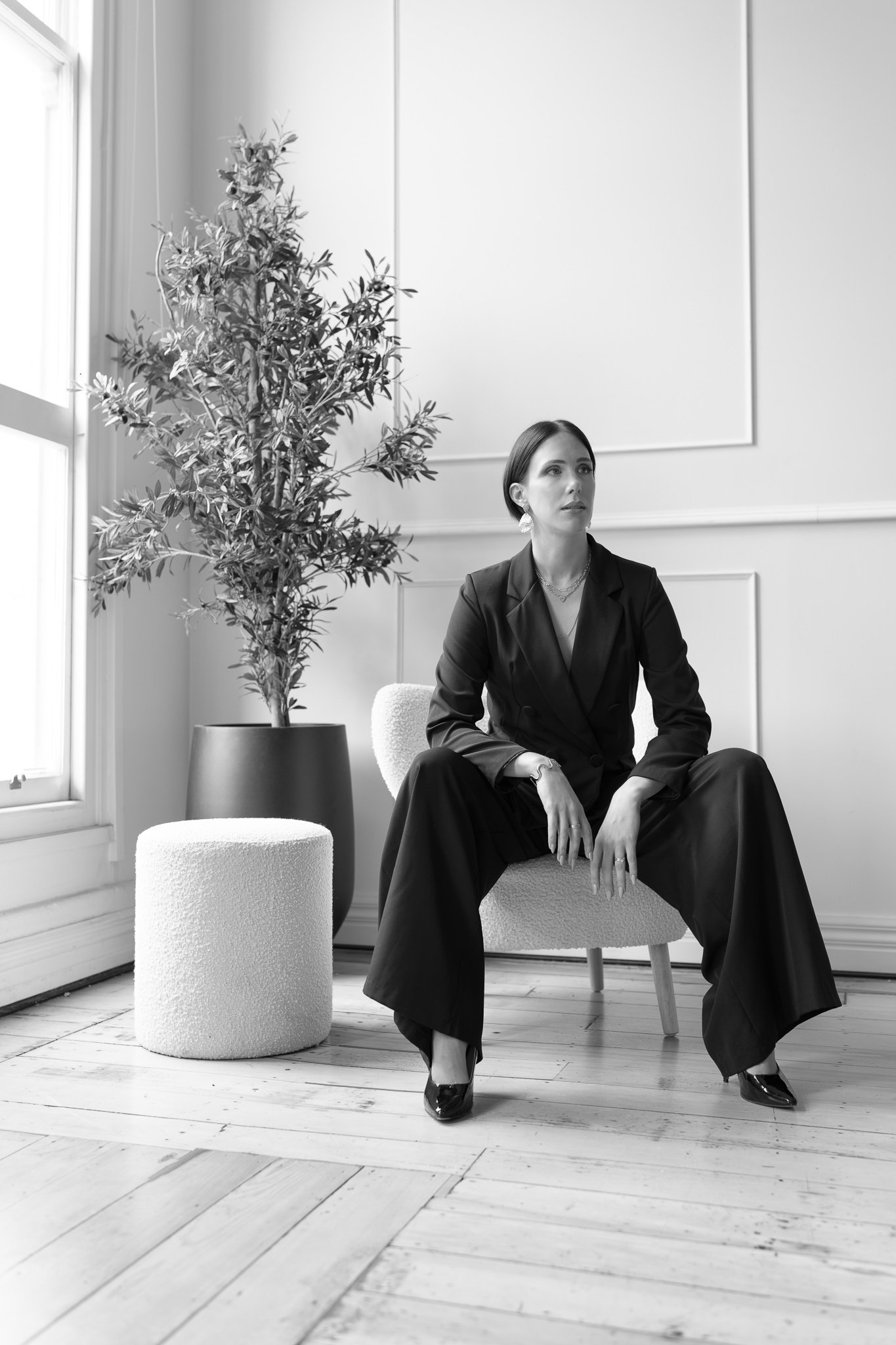Black and white photo of Nat seated by the window