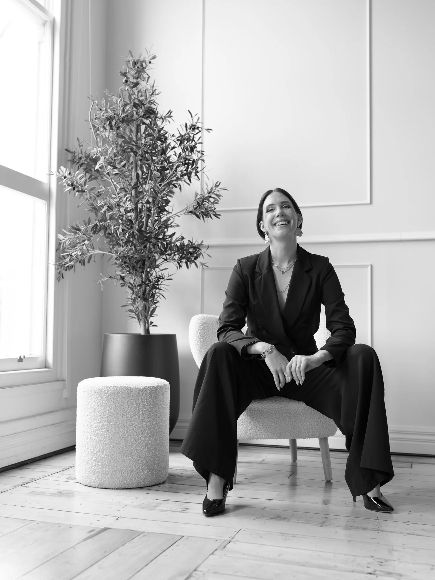 Black and white photo of Nat laughing