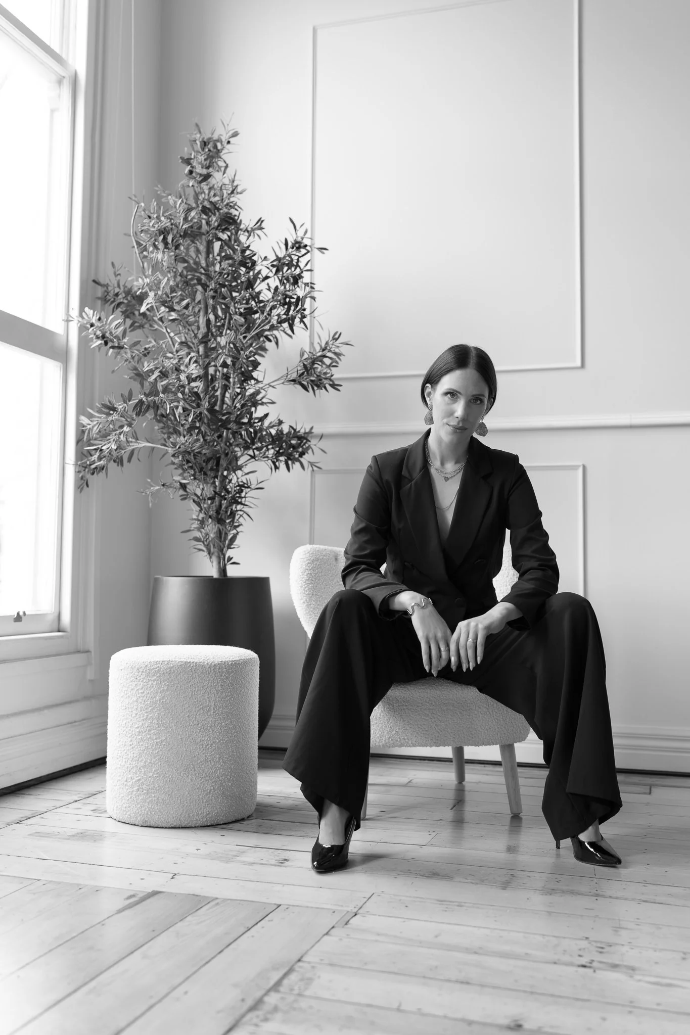 Black and white photo of Nat in a confident pose