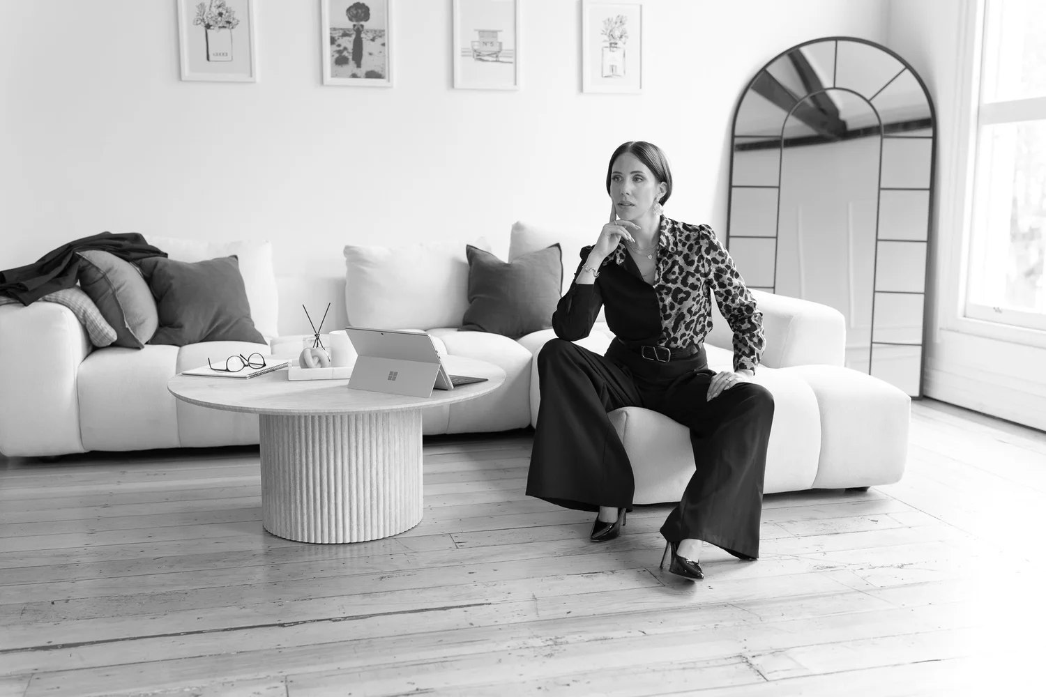 Black and white photo of Nat with her chin on her hand