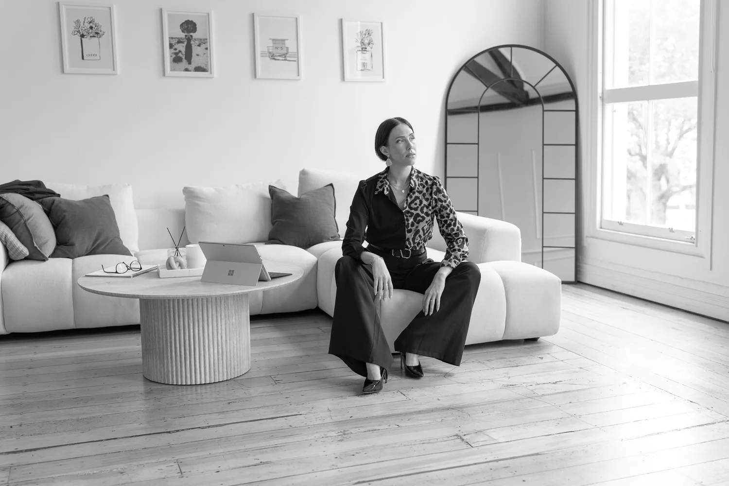 Black and white photo of Nat in a bright lounge