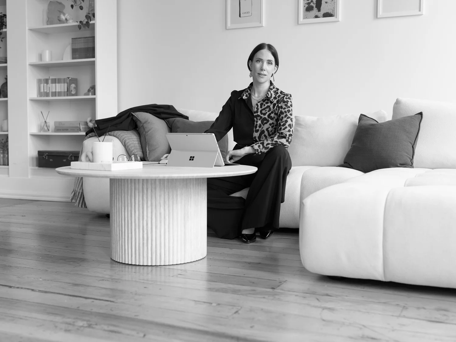 Black and white photo of Nat working on her laptop