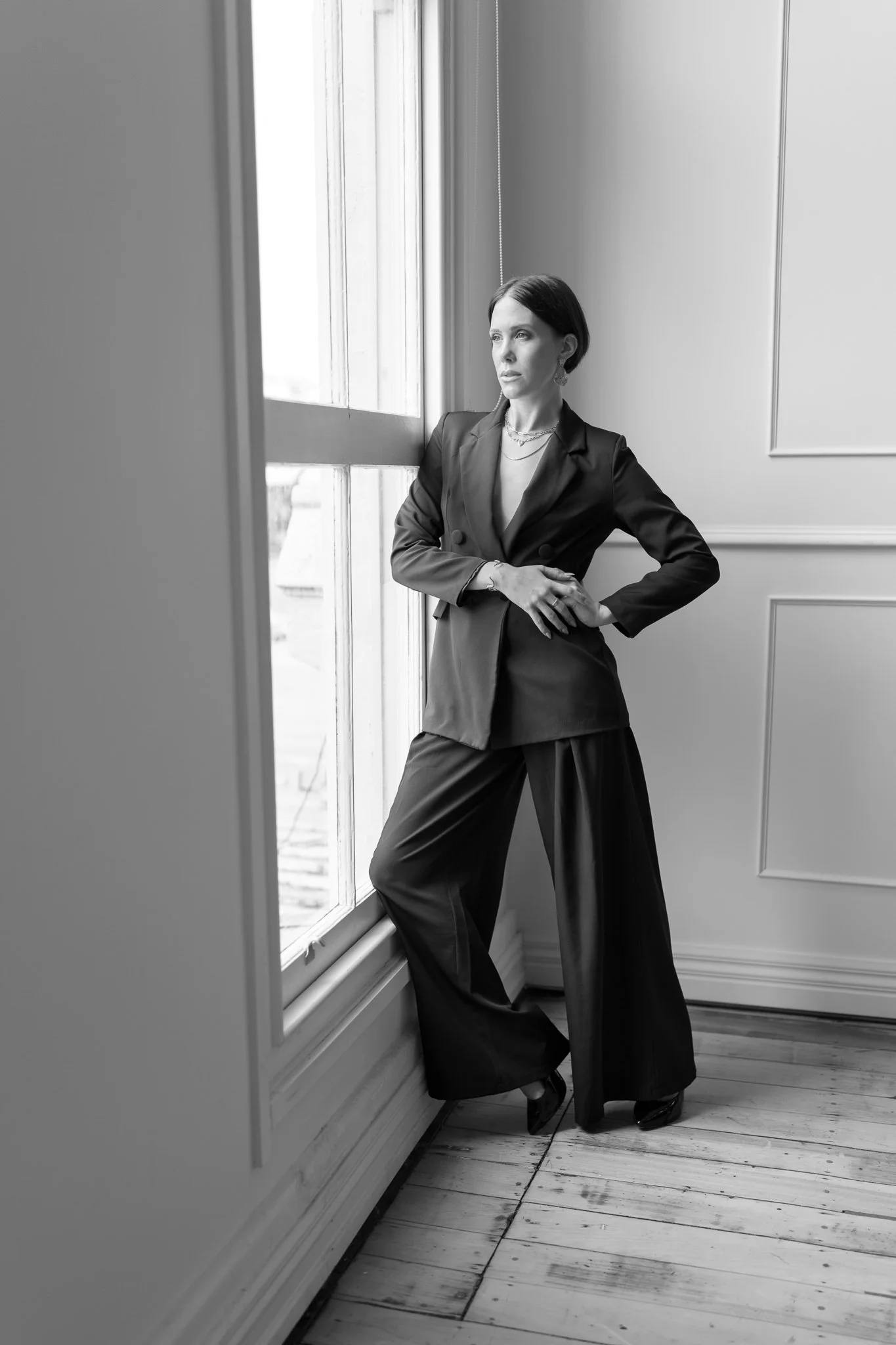 Black and white photo of Nat with a hand on her hip