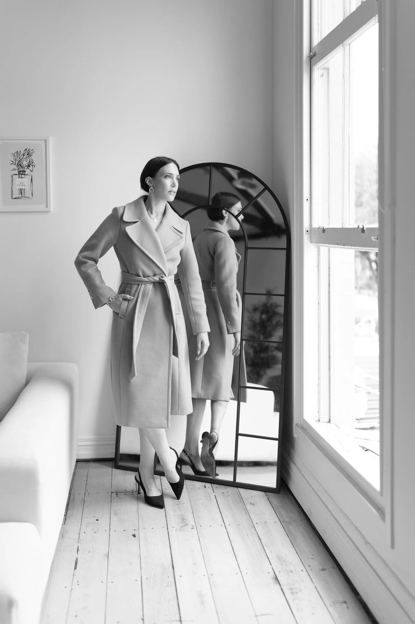 Black and white photo of Nat with hands on hips