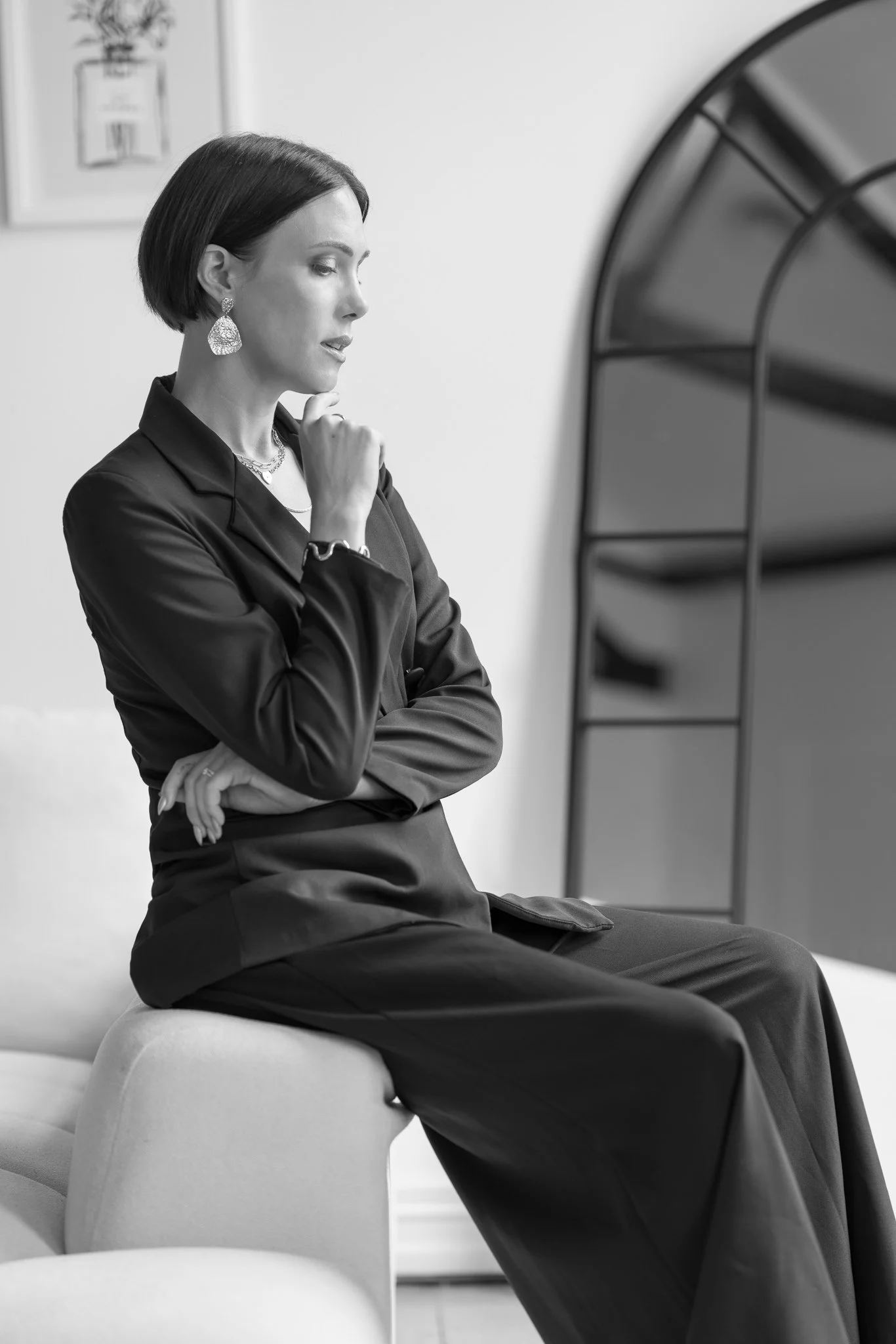 Black and white photo of Nat seated thoughtfully