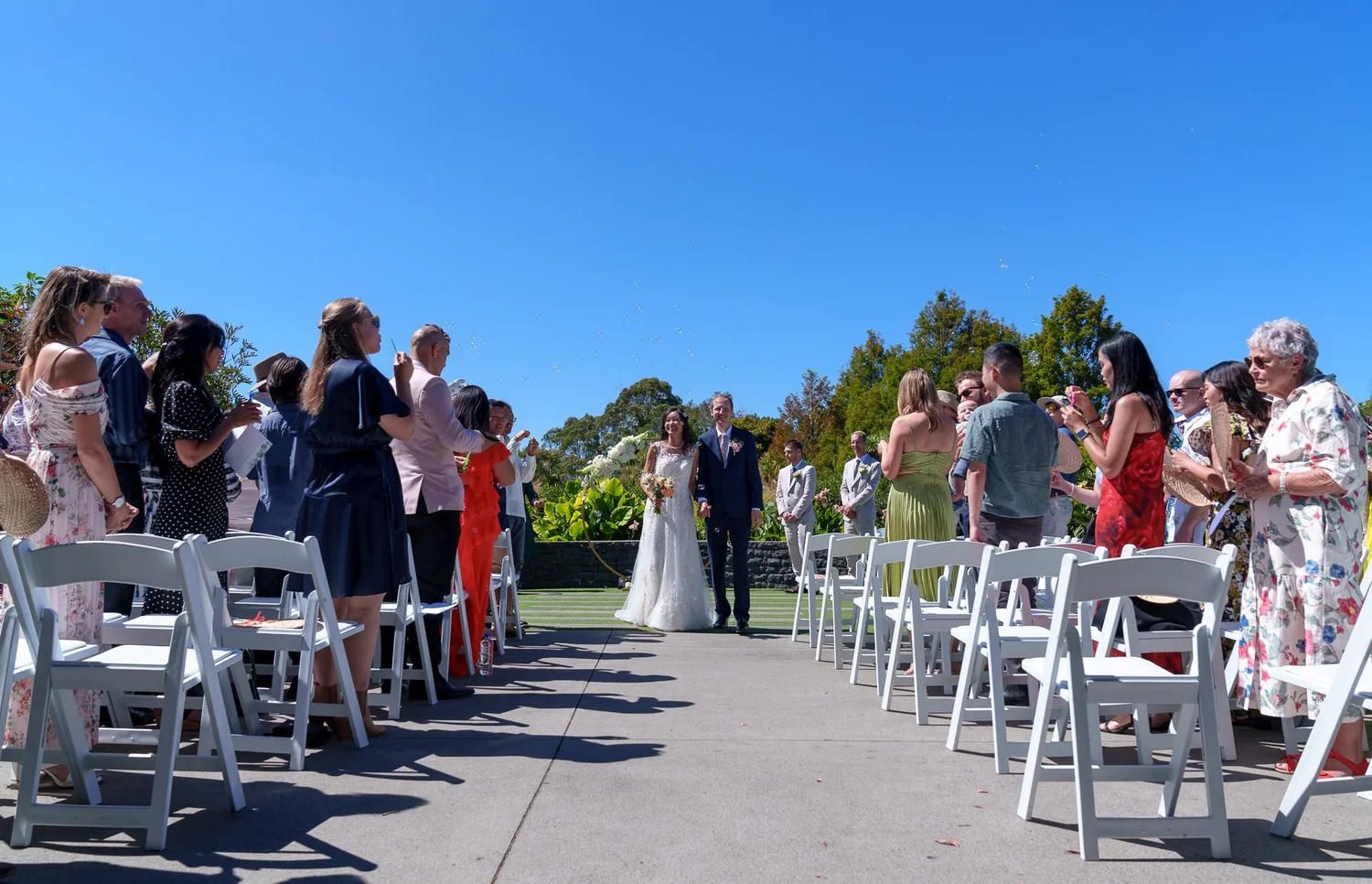 Guests gathered for the outdoor ceremony at Auckland Botanic Gardens