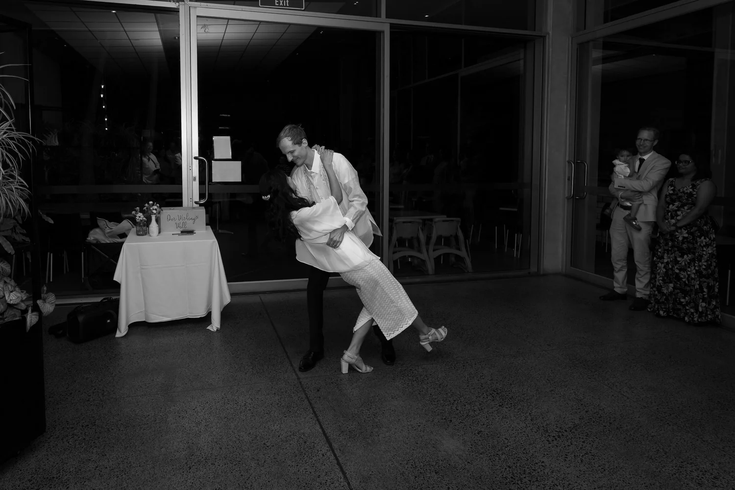 Black and white photo of James dipping Gel on the dance floor