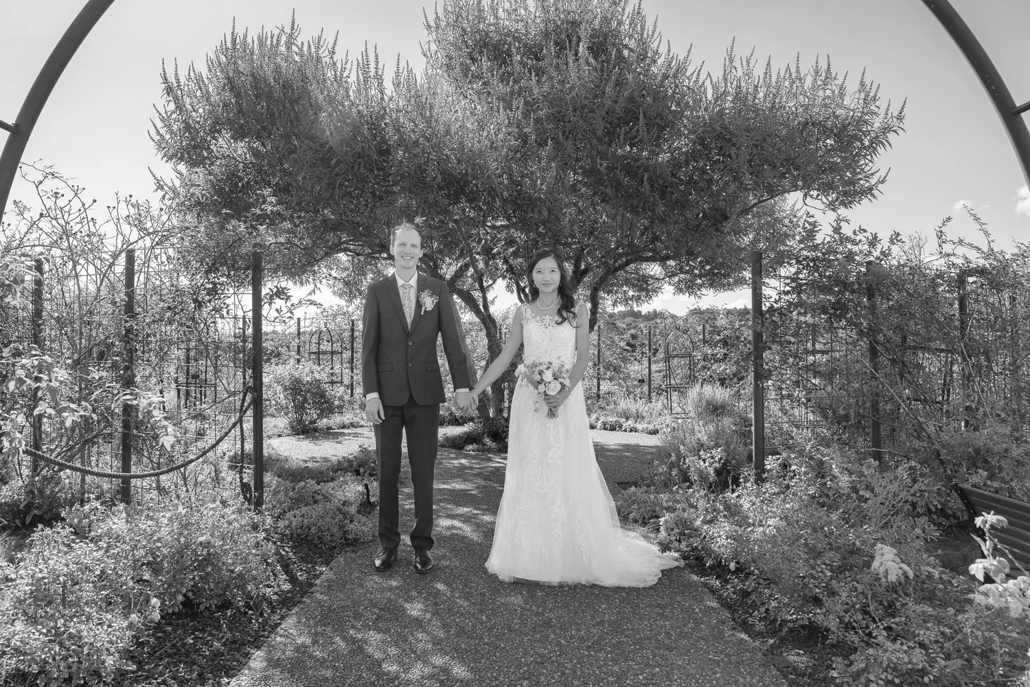 Black and white photo of Gel and James in the walled garden