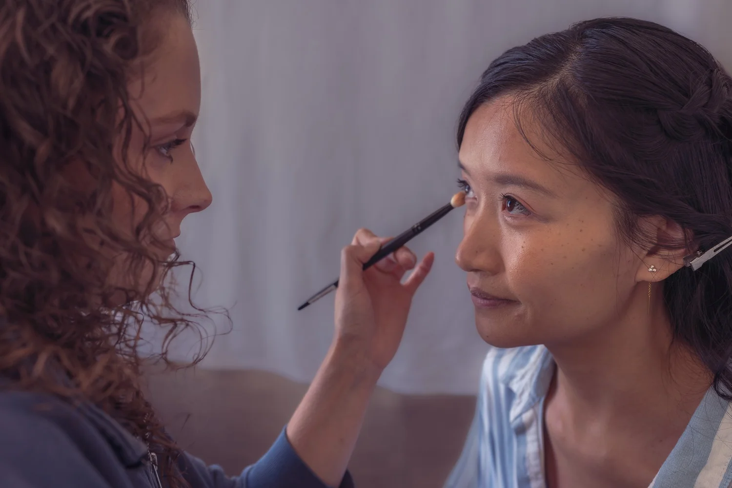 Gel has her makeup applied during bridal preparations