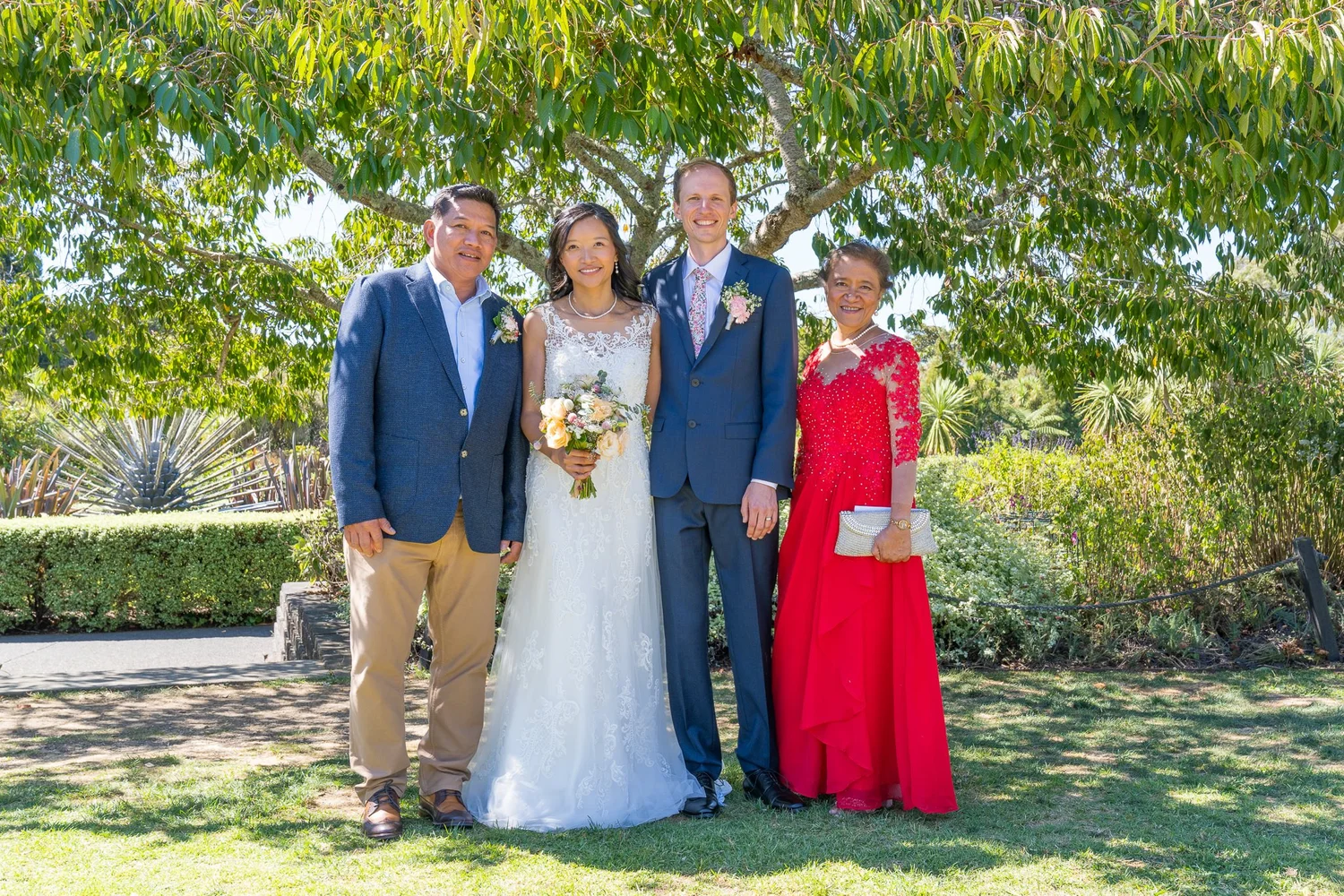 Gel and James with family on the lawn