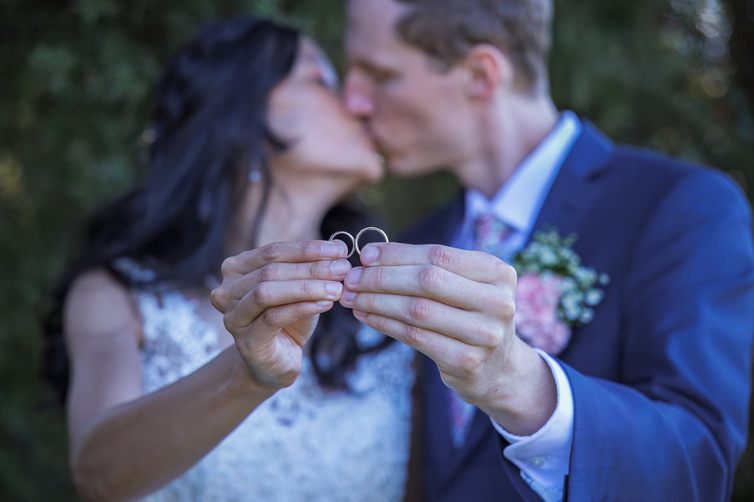 Gel and James kiss while holding up their rings