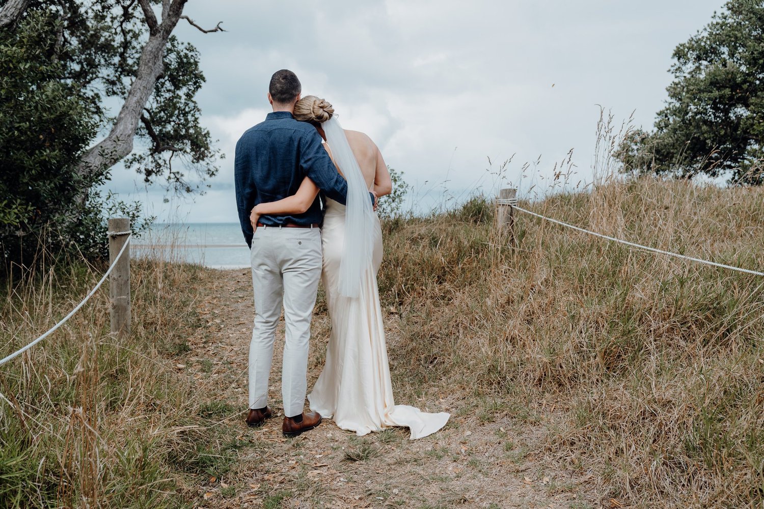 Rebecca and Michael embrace on the coastal path