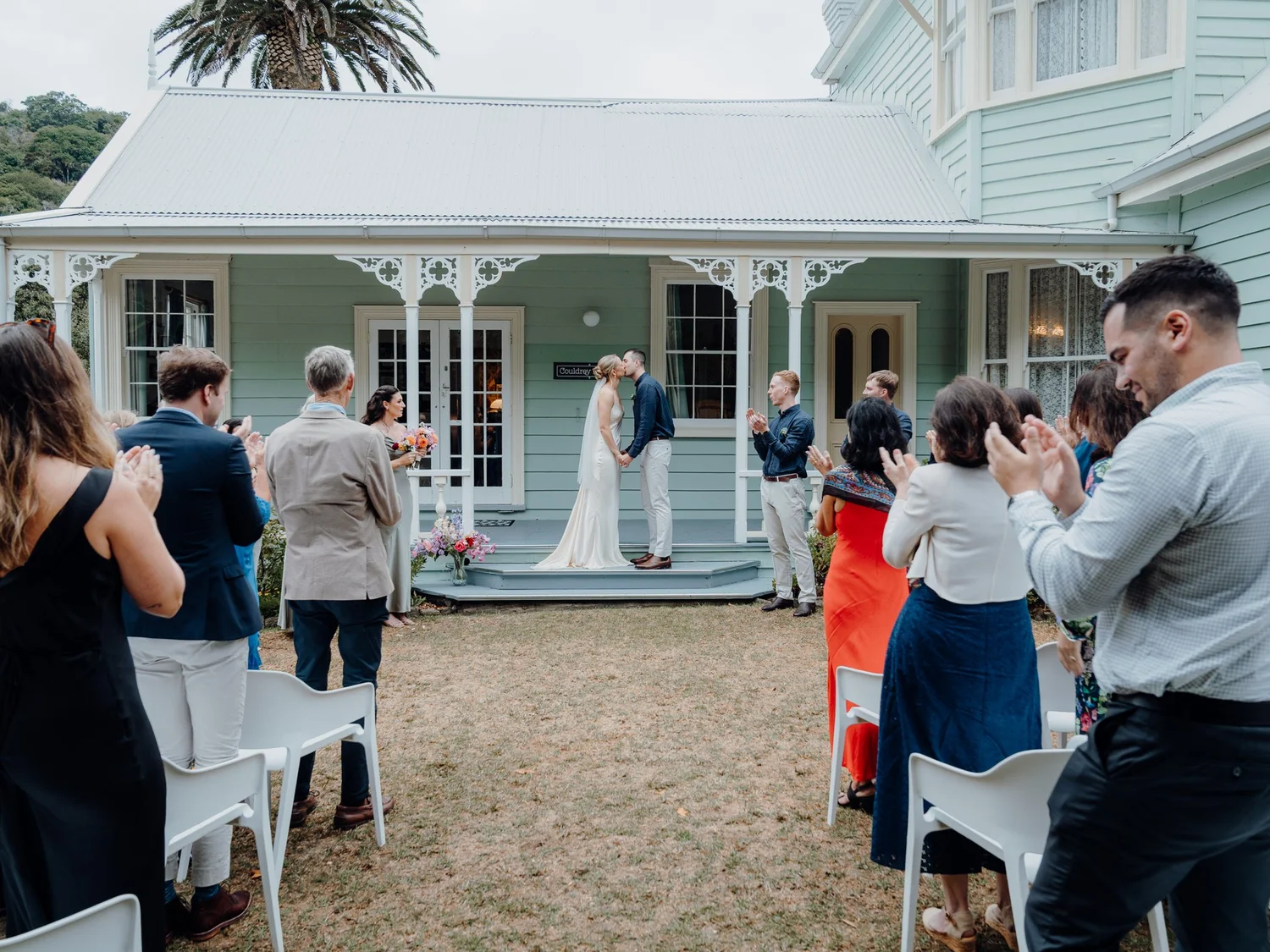 Guests watch the ceremony on the veranda of Cauldrey House