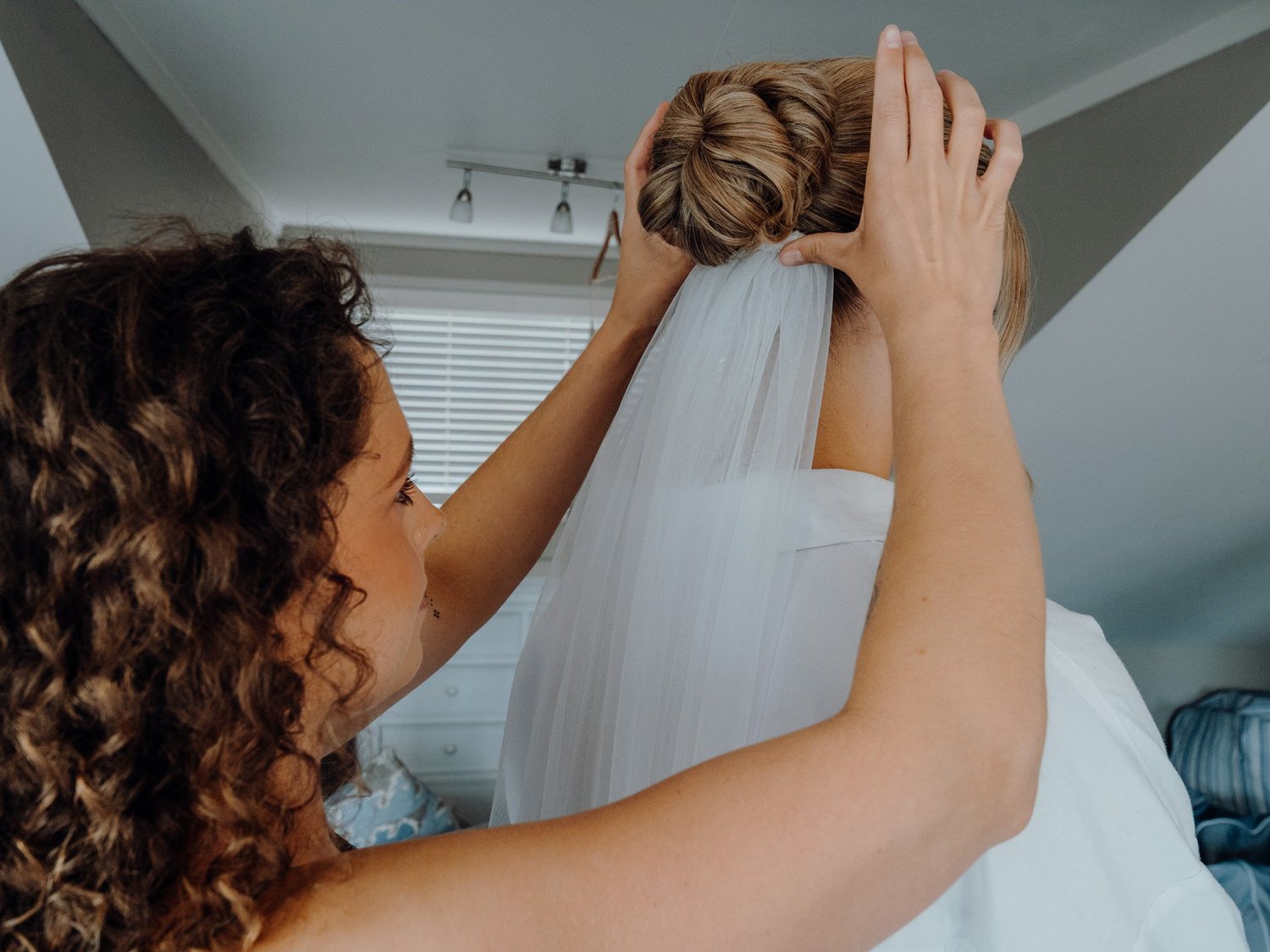 Rebecca's veil is pinned into her hair