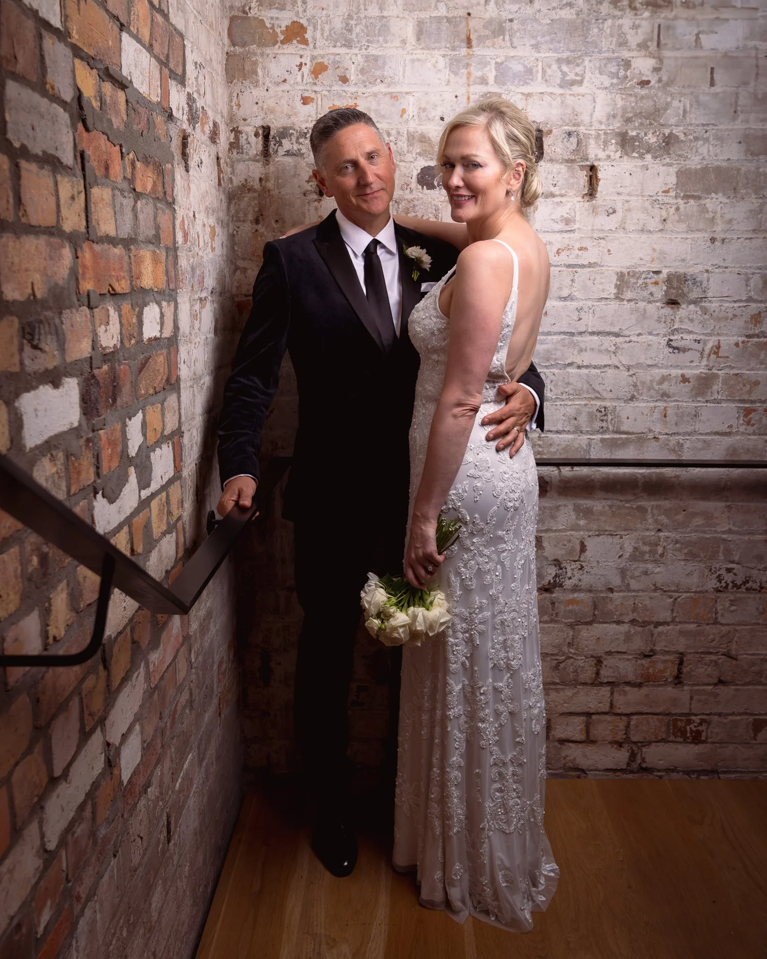 Shannon and Darren on a brick stairwell