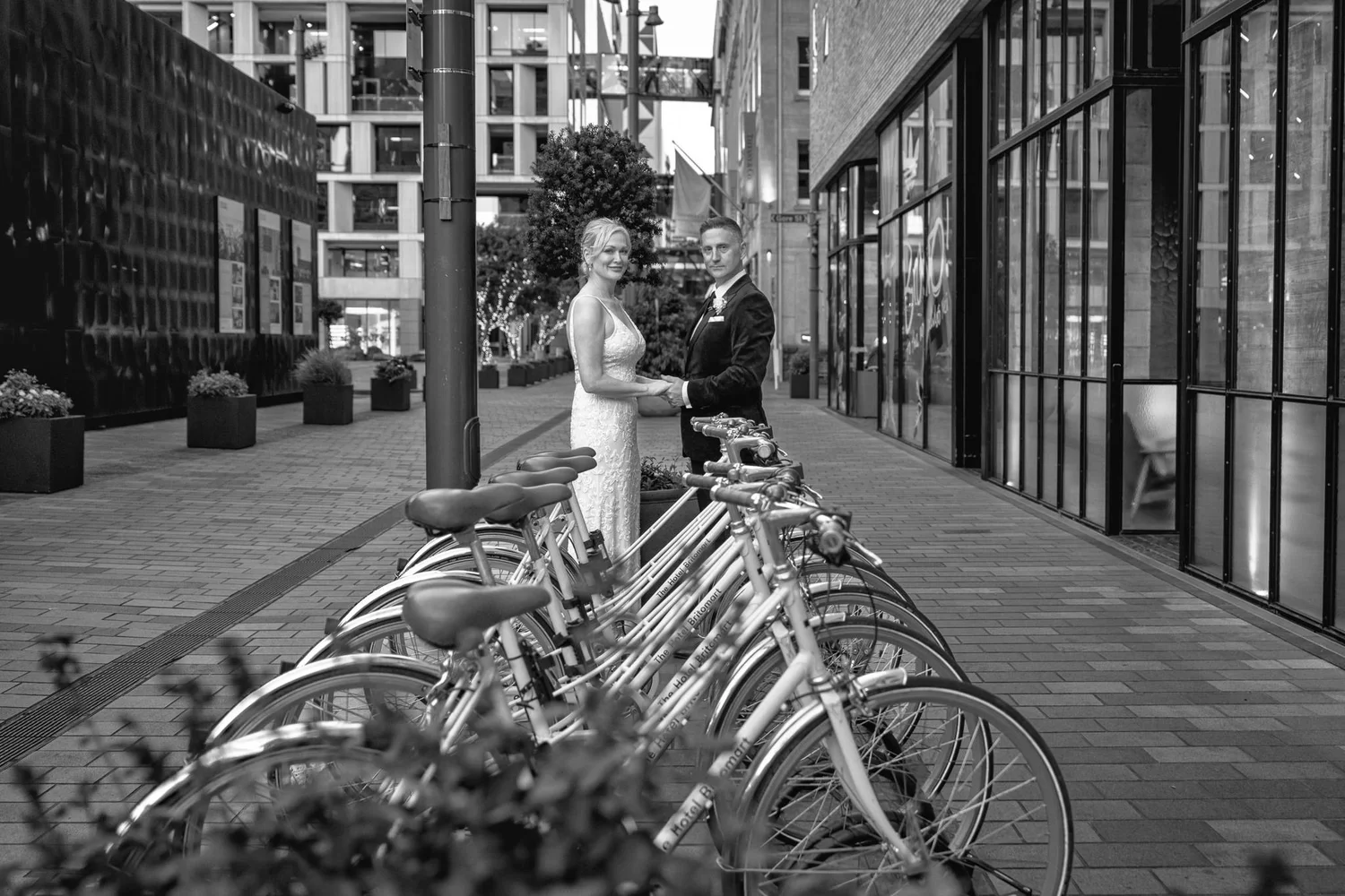 Black and white photo of the couple beside the bicycles
