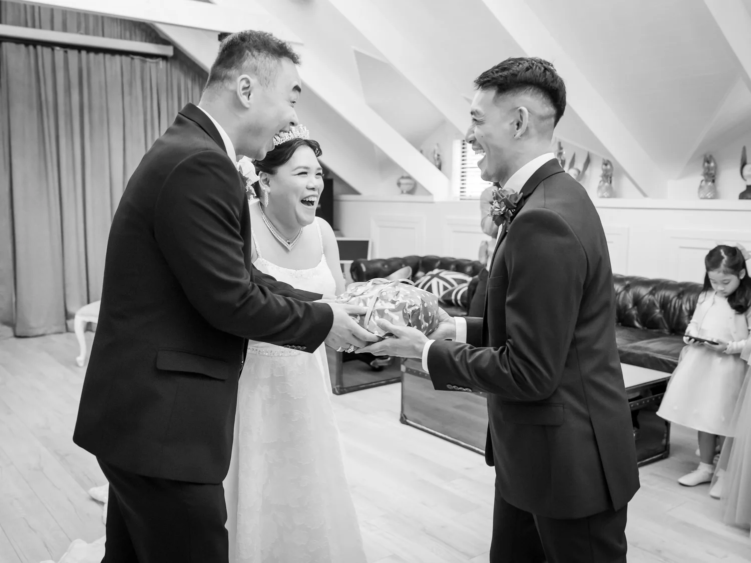 Black and white photo of Jankai greeting family before the ceremony