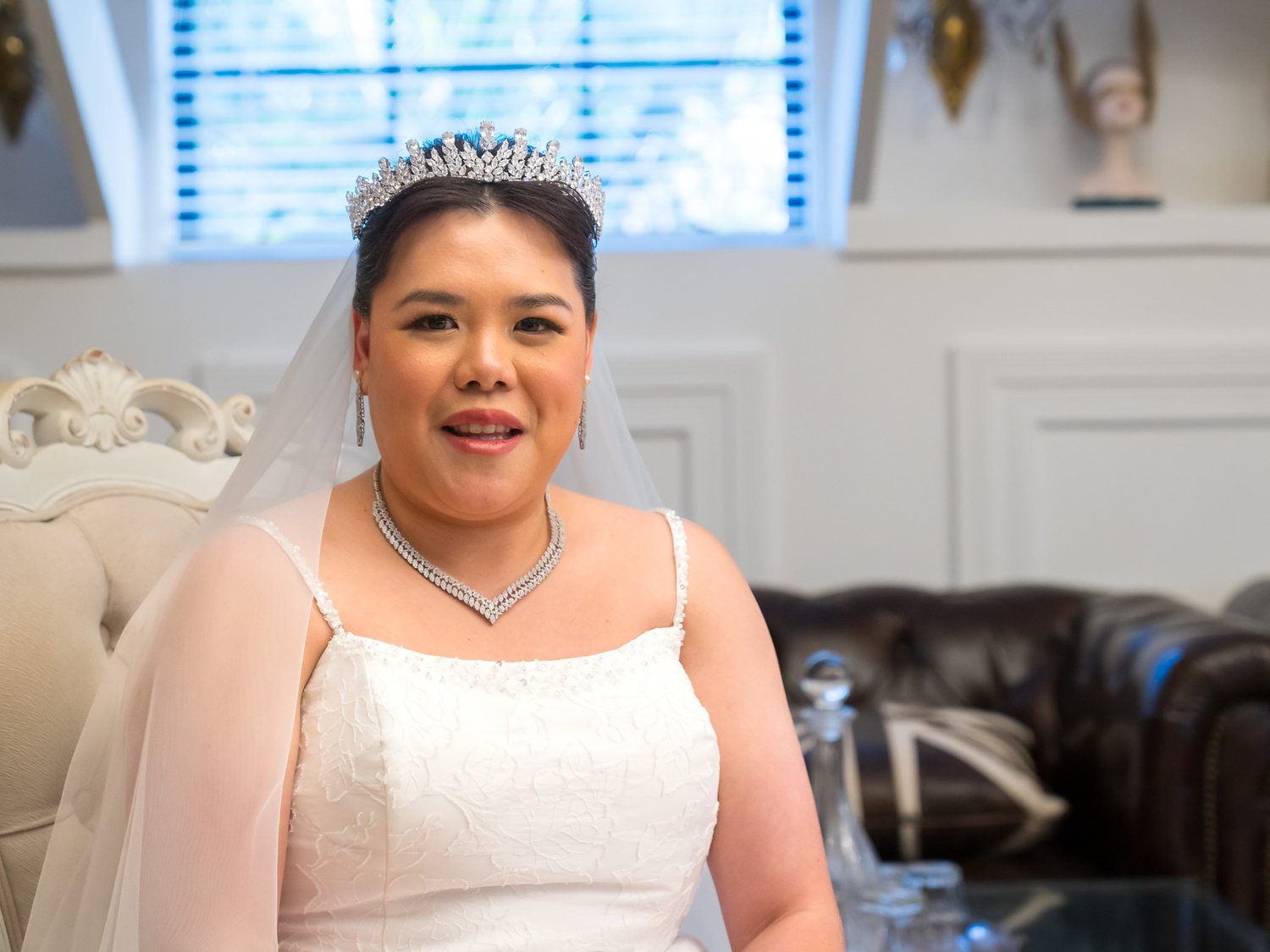 Stephanie smiles in her tiara during preparations