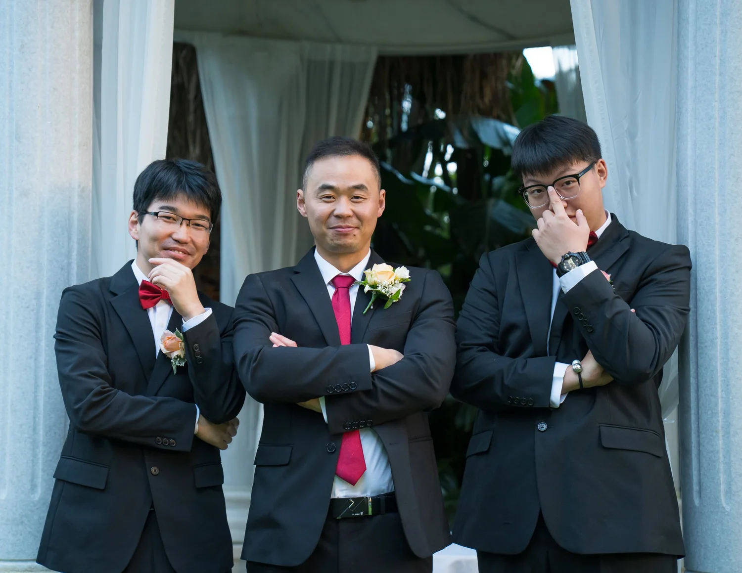 Jankai and two groomsmen strike a pose